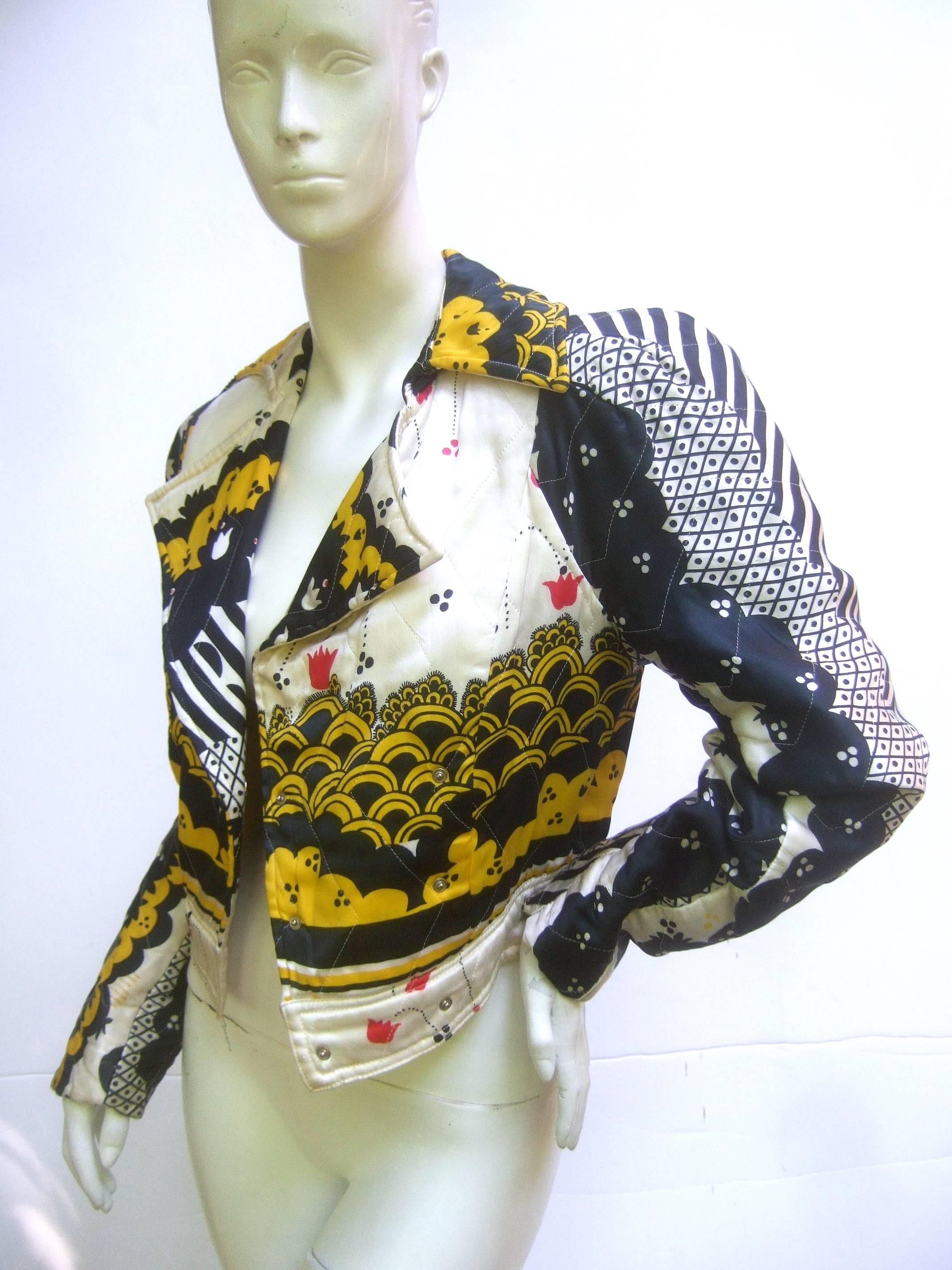 Ossie Clark quilted satin bomber jacket with Celia Birtwell fabric.
This is super rare! Don't miss it!  Pop snap buttons. Incredible romantic puffed sleeves contrast with sharp tailoring and disco style lapels. Historically, this is such an
