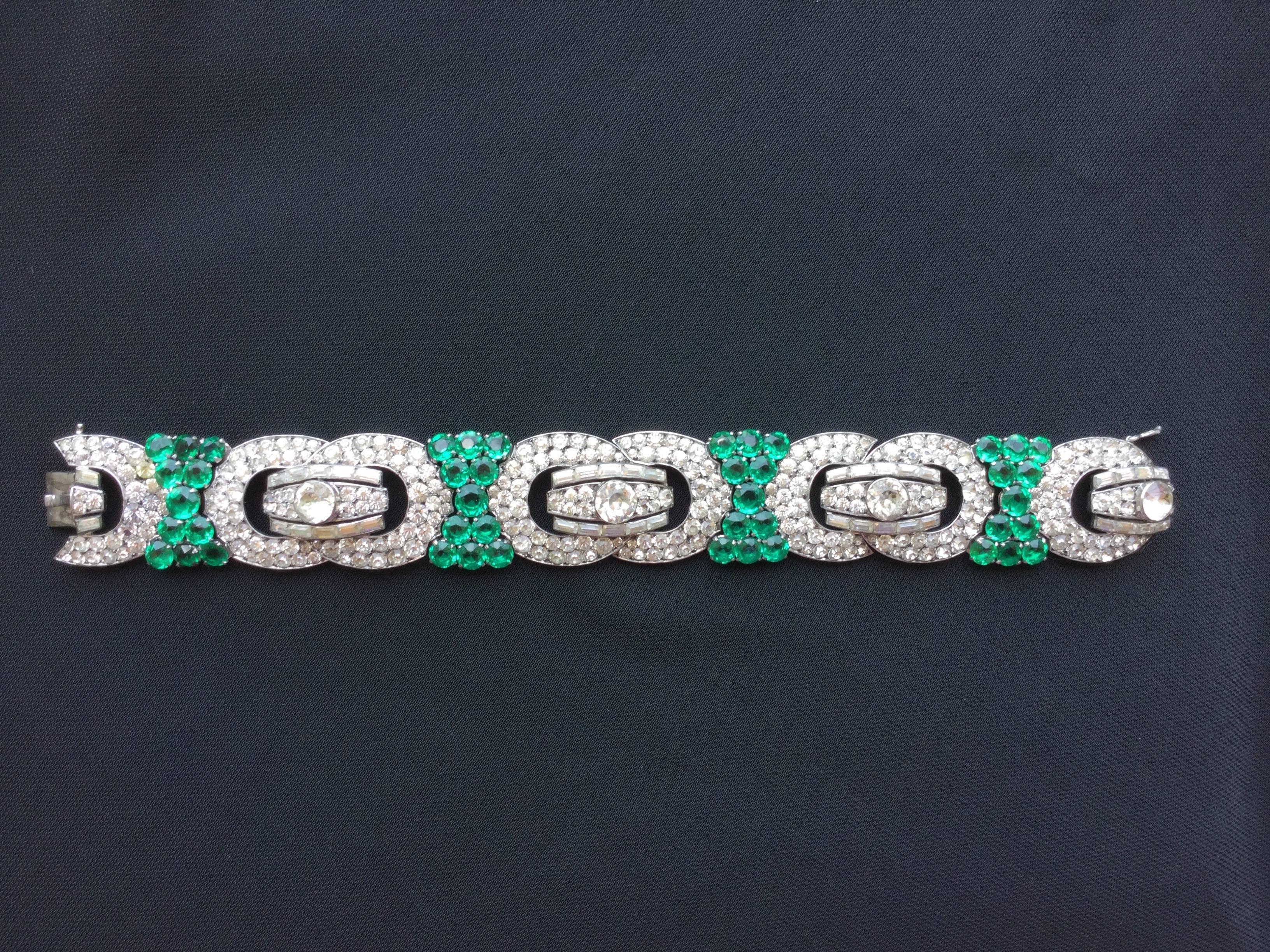 Knoll and Pregizer made some of the most exquisite Art Deco costume jewelry of the 1930's. Their pieces rarely appear on the market today. This gorgeous bracelet has faux emerald and diamond pastes of the finest quality all handset on sterling