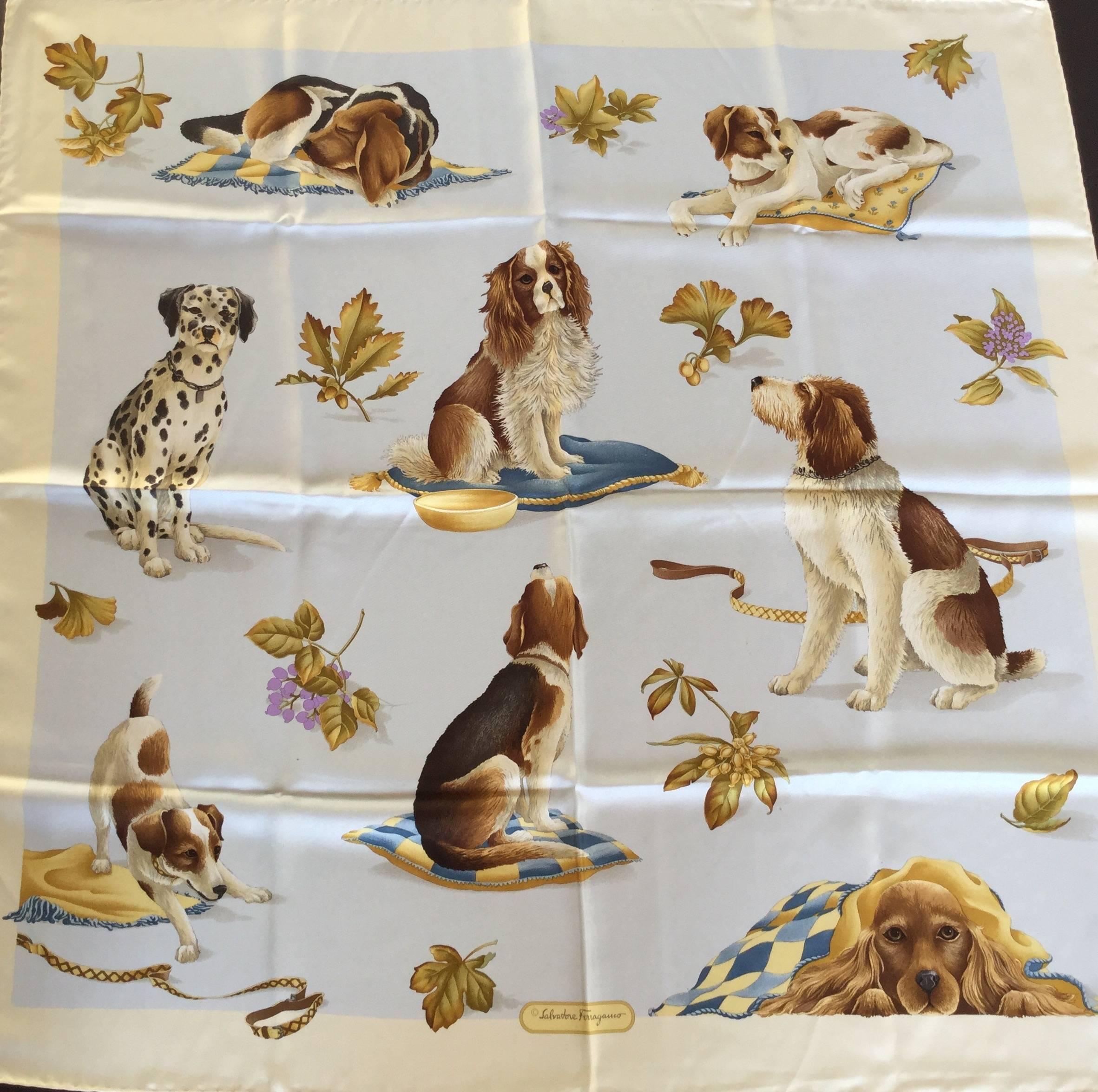 This Ferragamo dog themed scarf with the pale blue background is one of his rarest and most beautiful. The detail is simply stunning. Eight different dog breeds are depicted in various poses with various gazes. The colors are rich yet restrained in