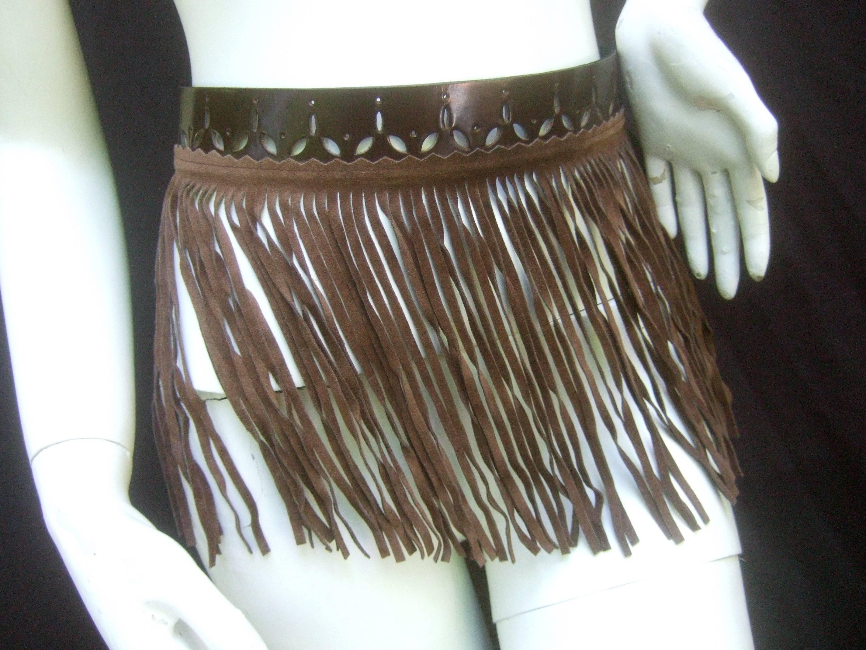 Exotic brown fringe suede belt designed by Herve Masson Paris 
The avant garde belt is designed with long sinuous 
brown suede tassels 

The belt is smooth brown leather with unique perforated 
cutout designs throughout. The versatile belt may be
