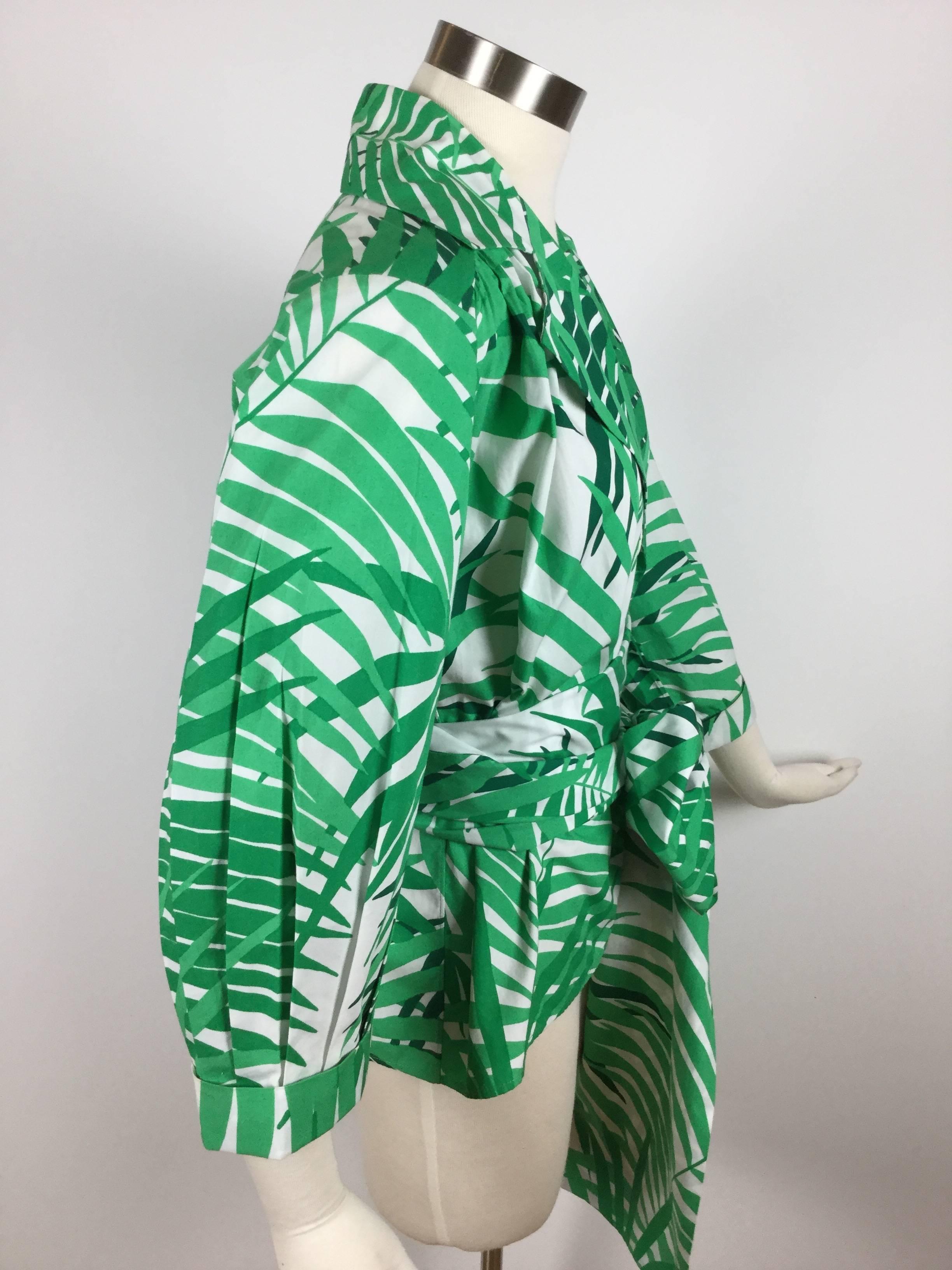 This is such a striking piece from Yves Saint Laurent!  Polished cotton jacket style wrap top with a gorgeous palm print. Sharp wide lapels. Comes with an incredible matching Obi belt that measures 11 FEET by 9 inches!  So bold and eye catching!
