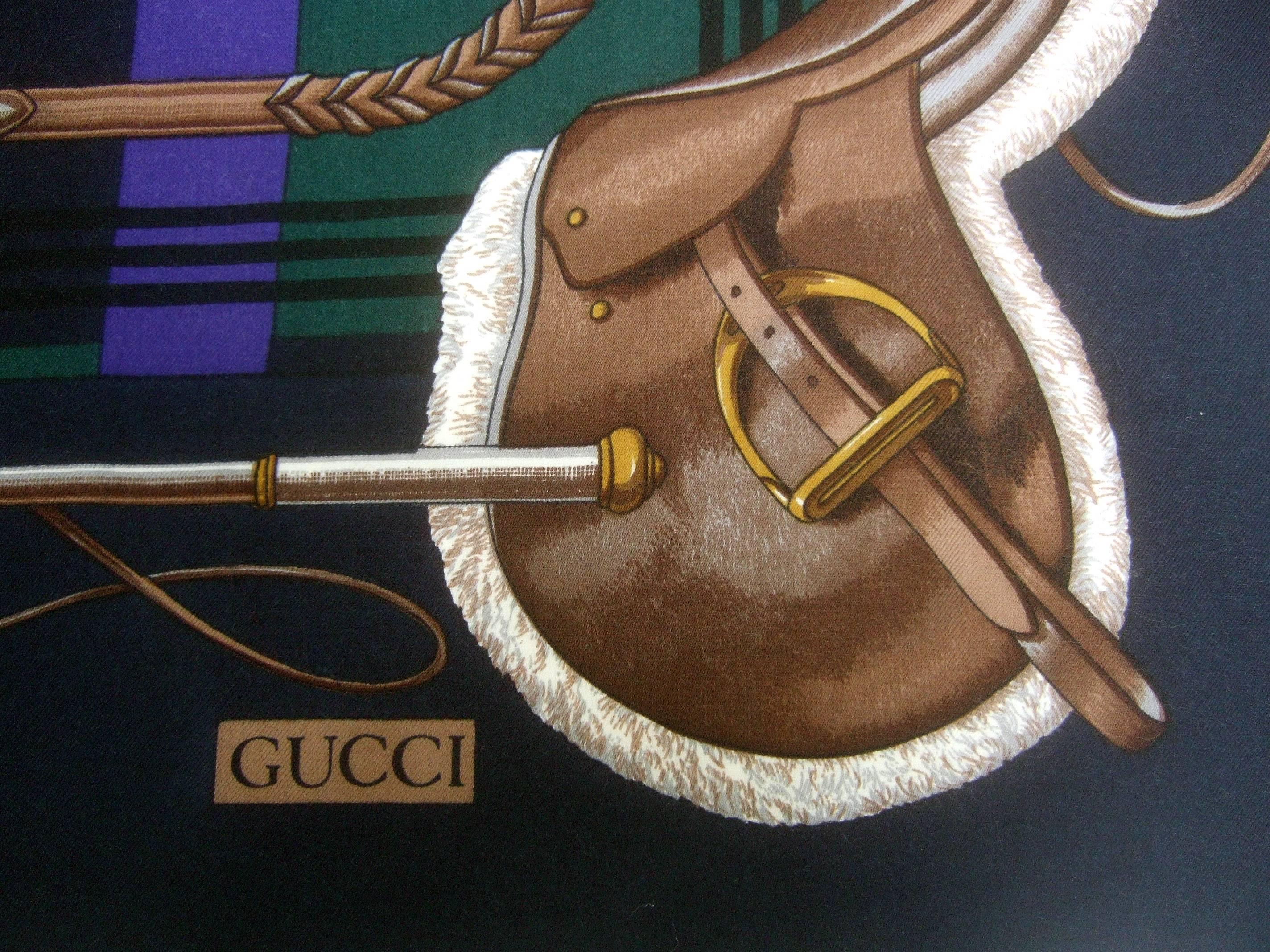 Gucci Italy Massive equestrian theme wool shawl - scarf measures 52 x 52 
The elegant Italian shawl - scarf is designed with color block
panels in eggplant purple and hunter green set against  
a black background 

Each of the four corners is