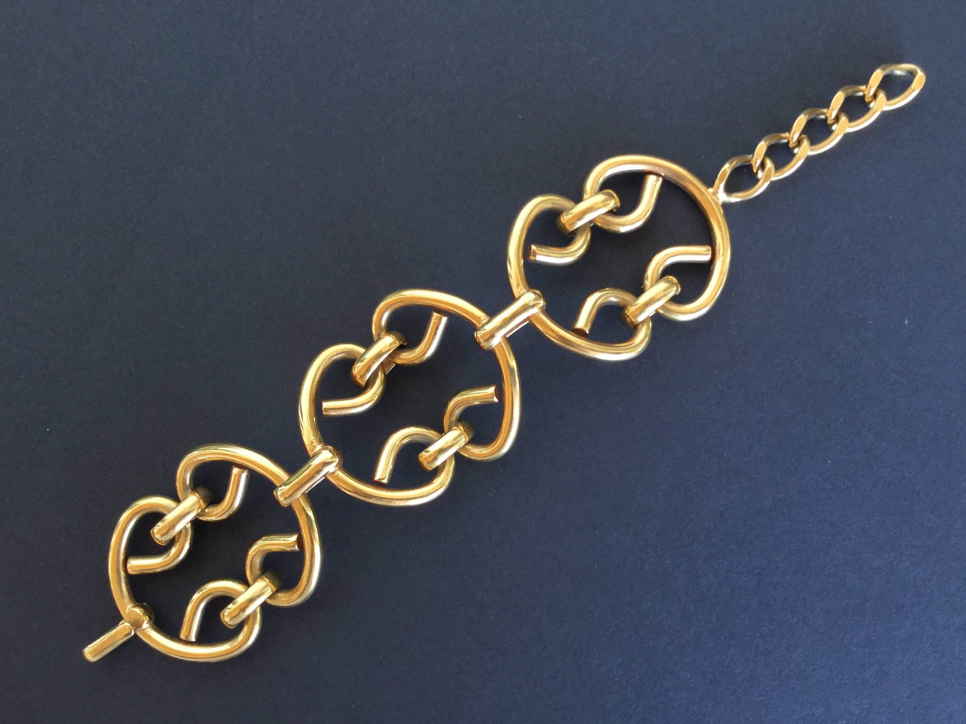 These older Chanel pieces just feel nothing like the newer ones! This gilt link bracelet is so solid and heavy. The gilding is quiet and restrained. Burnished instead of flashy like newer pieces can be. Simple but striking design dating from the