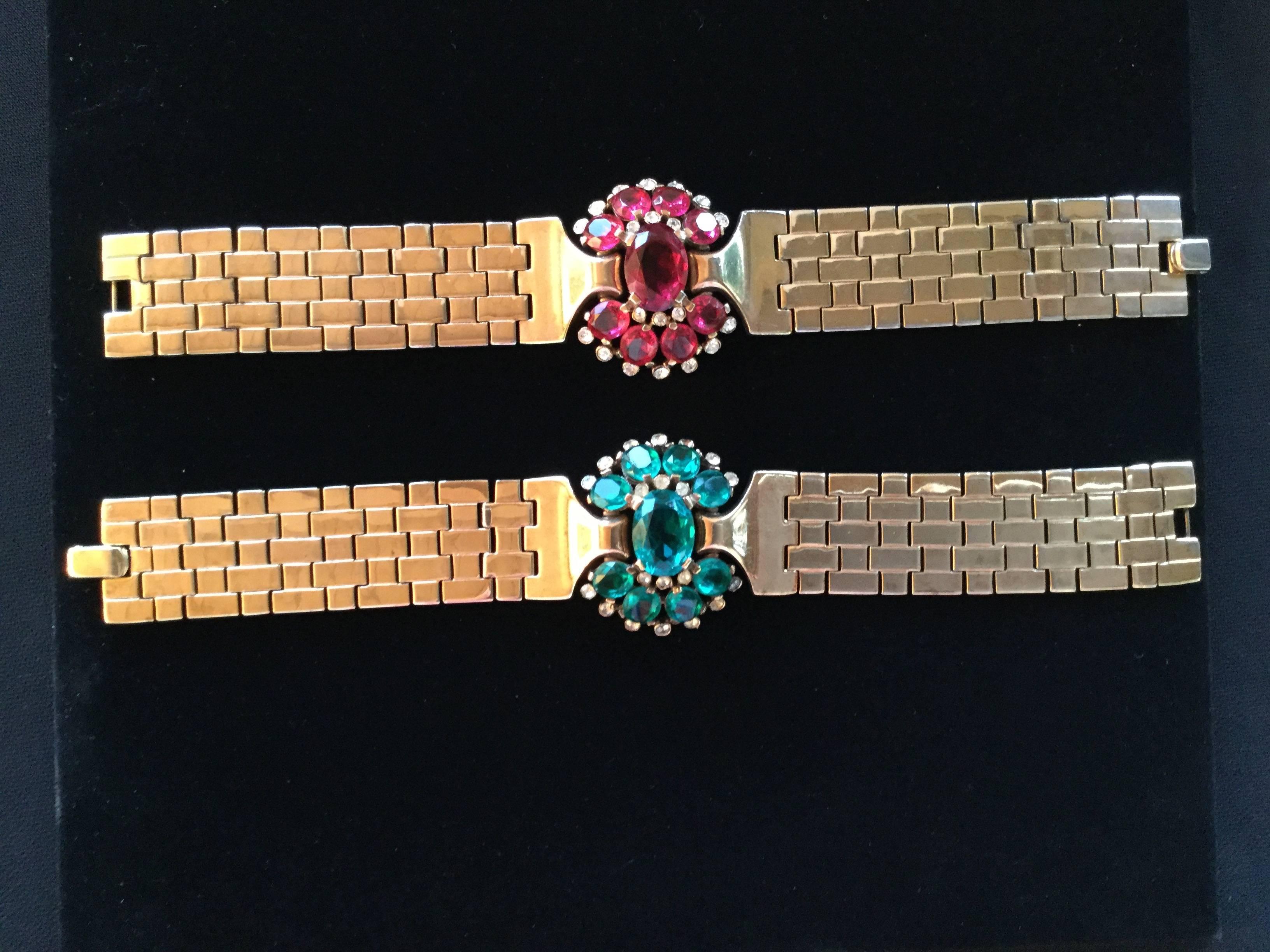 A pair of large scale Retro Moderne style bracelets designed by Alfred Philippe. Echoing Philippe's earlier work for Cartier and Van Cleef, these channel the feeling of the dramatic precious cocktail jewels so beloved by 1940's movie stars during