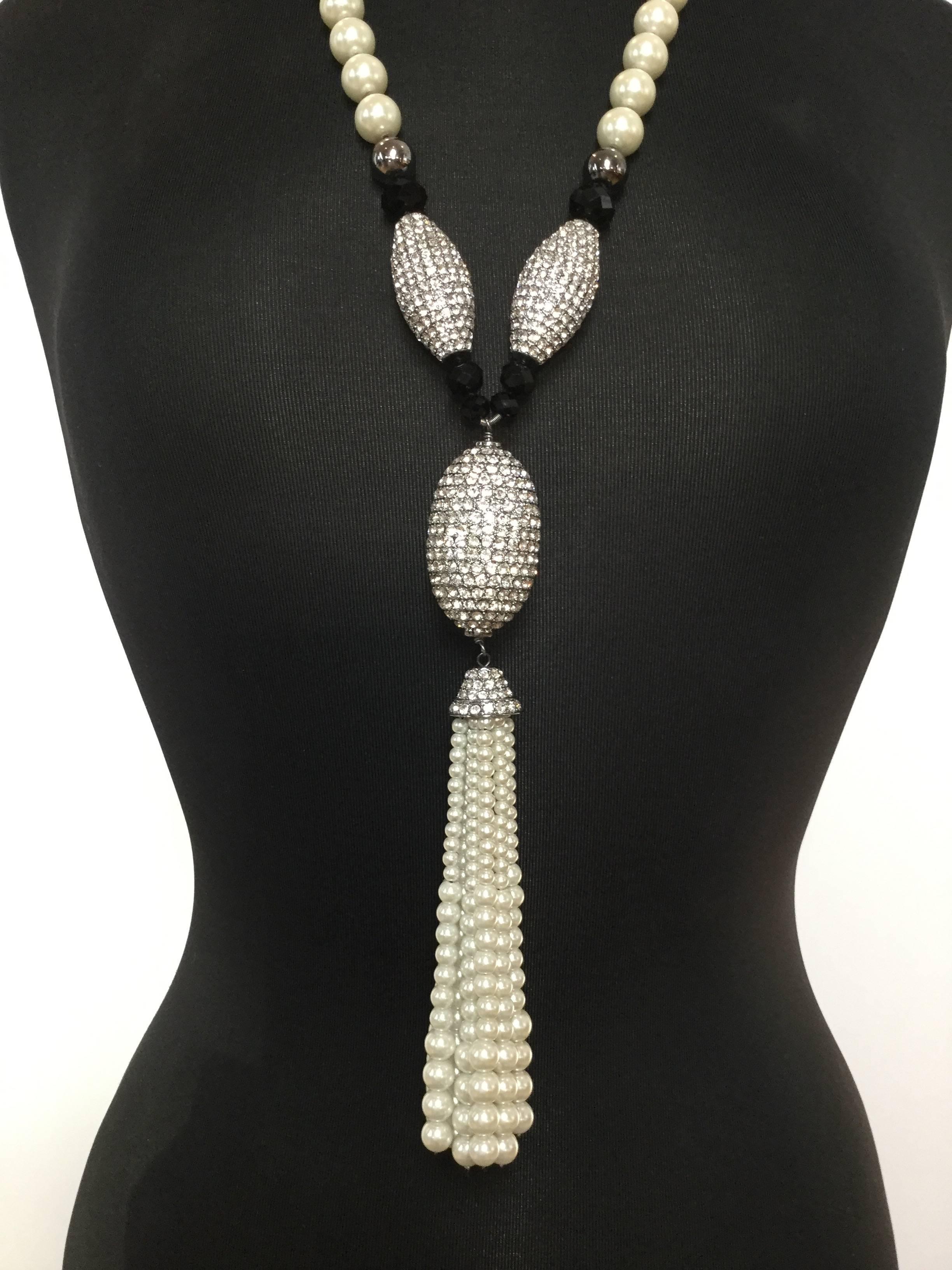 This stunning runway necklace is just huge and gorgeous!  Ultra long Yves Saint Laurent faux pearl, crystal, and jet glass sautoir.  All hand knotted. Incredible quality. Art Deco style featuring a central pave egg shaped focal which caps a ten