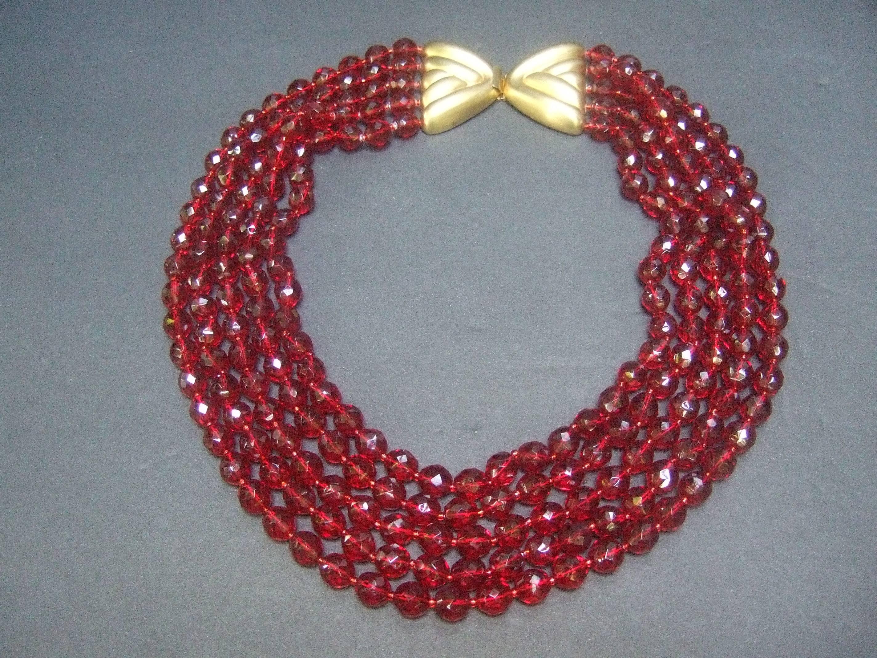 Valentino Exquisite cranberry crystal statement necklace c 1980
The show stopping necklace is designed with five graduated
strands of brilliant deep red glittering crystals 

Makes a very elegant dramatic accessory perfect for the holidays

The five