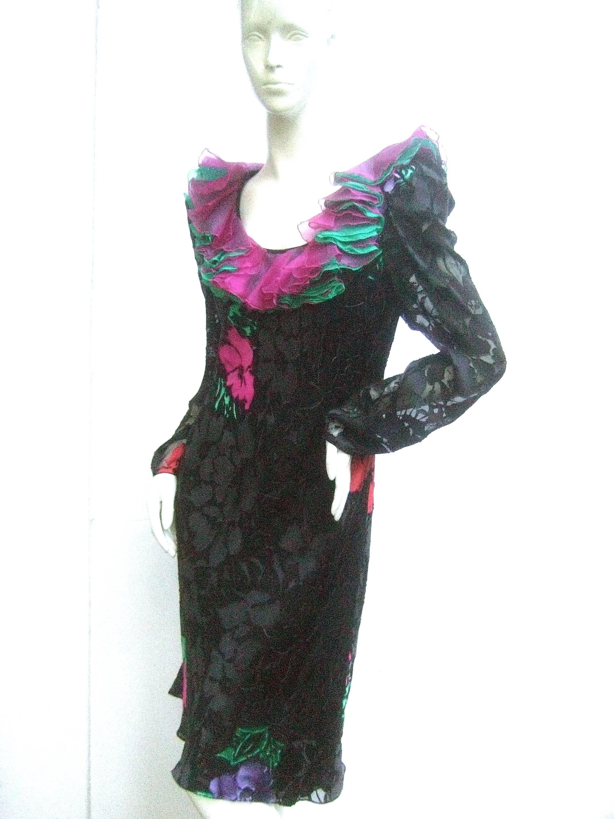 Judy Hornby Couture black silk floral burnout dress c 1990
The stylish dress is designed with a dramatic ruffled 
pastel silk collar that emulates flower pedals 

The sheer black silk burnout fabric has burst of vibrant 
flower blooms. Subtle floral