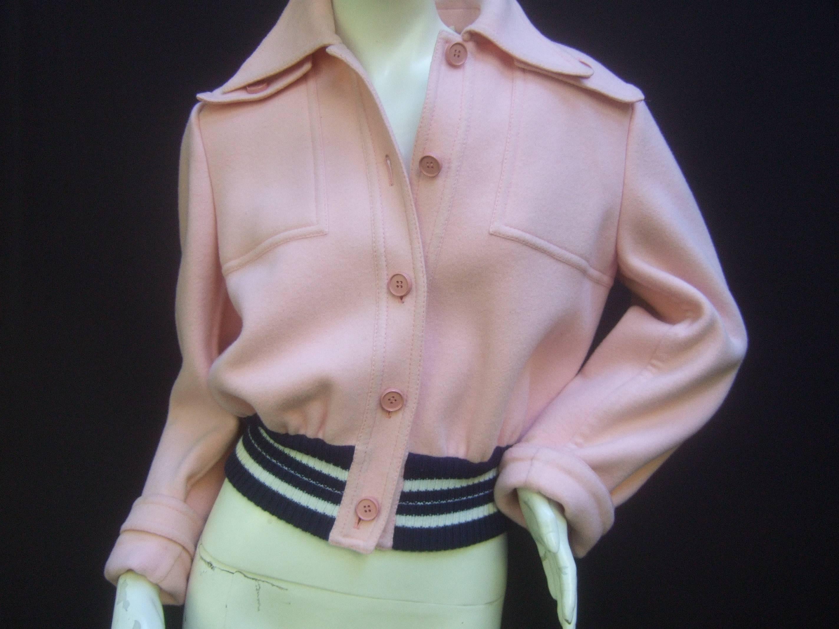 Valentino Boutique Italy Blush pink wool Eisenhower style jacket 
The crisp pale pink mod wool jacket is designed with a wide 
pointed collar. Has a pair of a deep patch pockets on each
front shoulder 

Adorned with a series of pink resin buttons