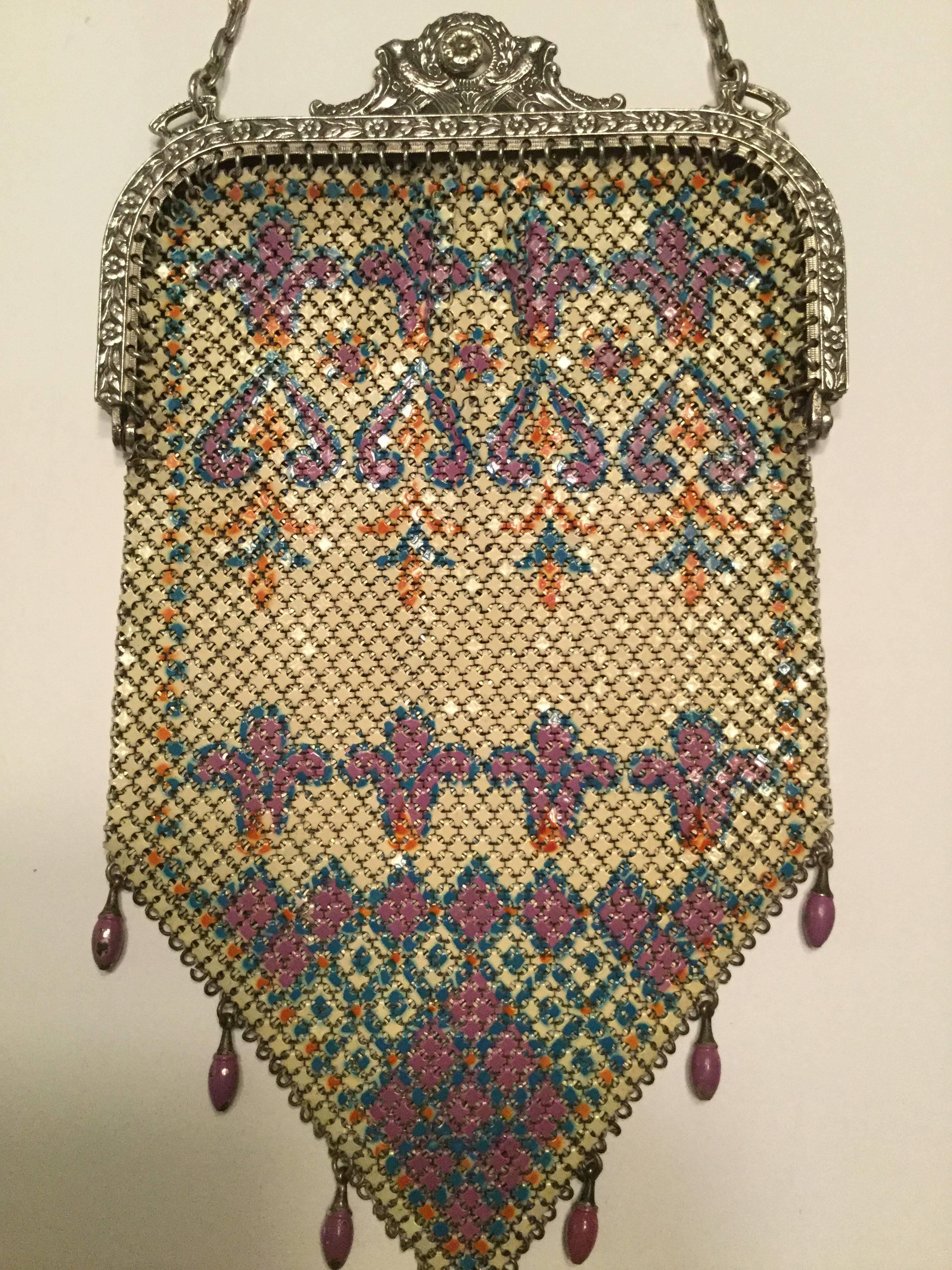 1920's Carpet style Art Deco flapper bag with a lustrous pearly enamel finish in gorgeous muted pastel tones. Intricate slinky chainmail mesh of individual enameled interlocked tiles. Incredible double bird clasp. Unlined. Signed: Mandalian. Great