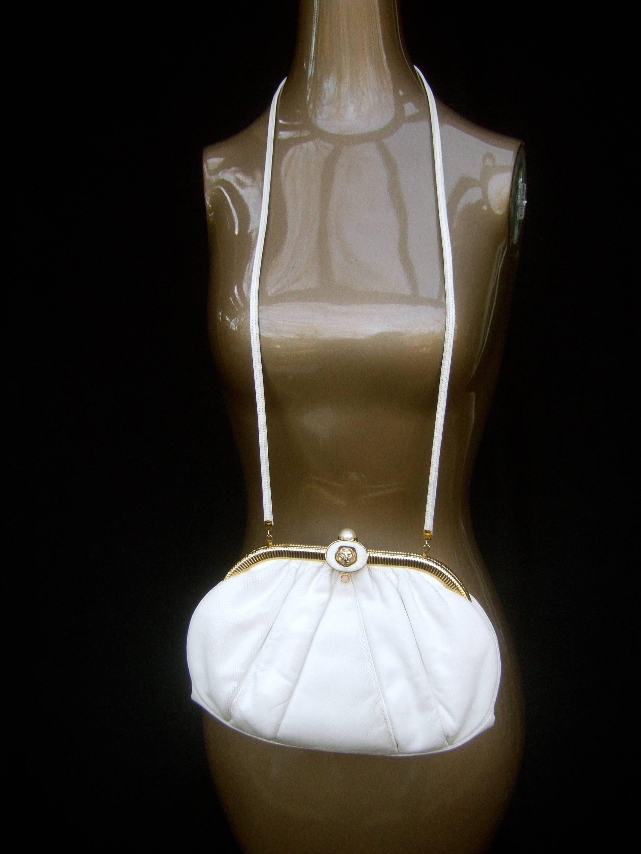 Judith Leiber Lion Clasp Embossed White Leather Handbag c 1980s In Good Condition In University City, MO