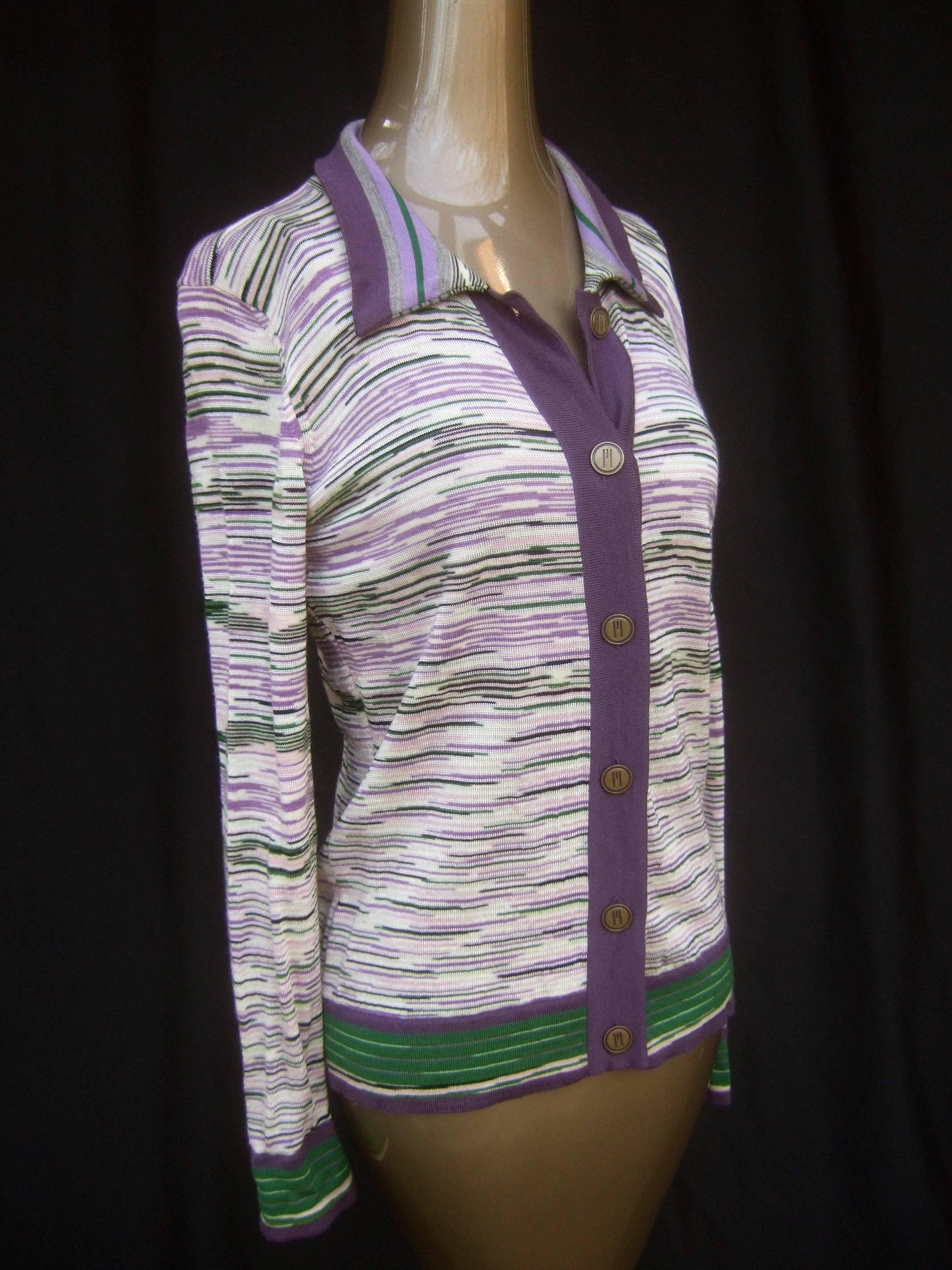 Missoni Italian striped wool knit cardigan 
The classic fine wool knit cardigan is designed 
with a series of horizontal stripes in various colors 

Buttons down the front with brass metal buttons 
inscribed with Missoni's M initial on each button
