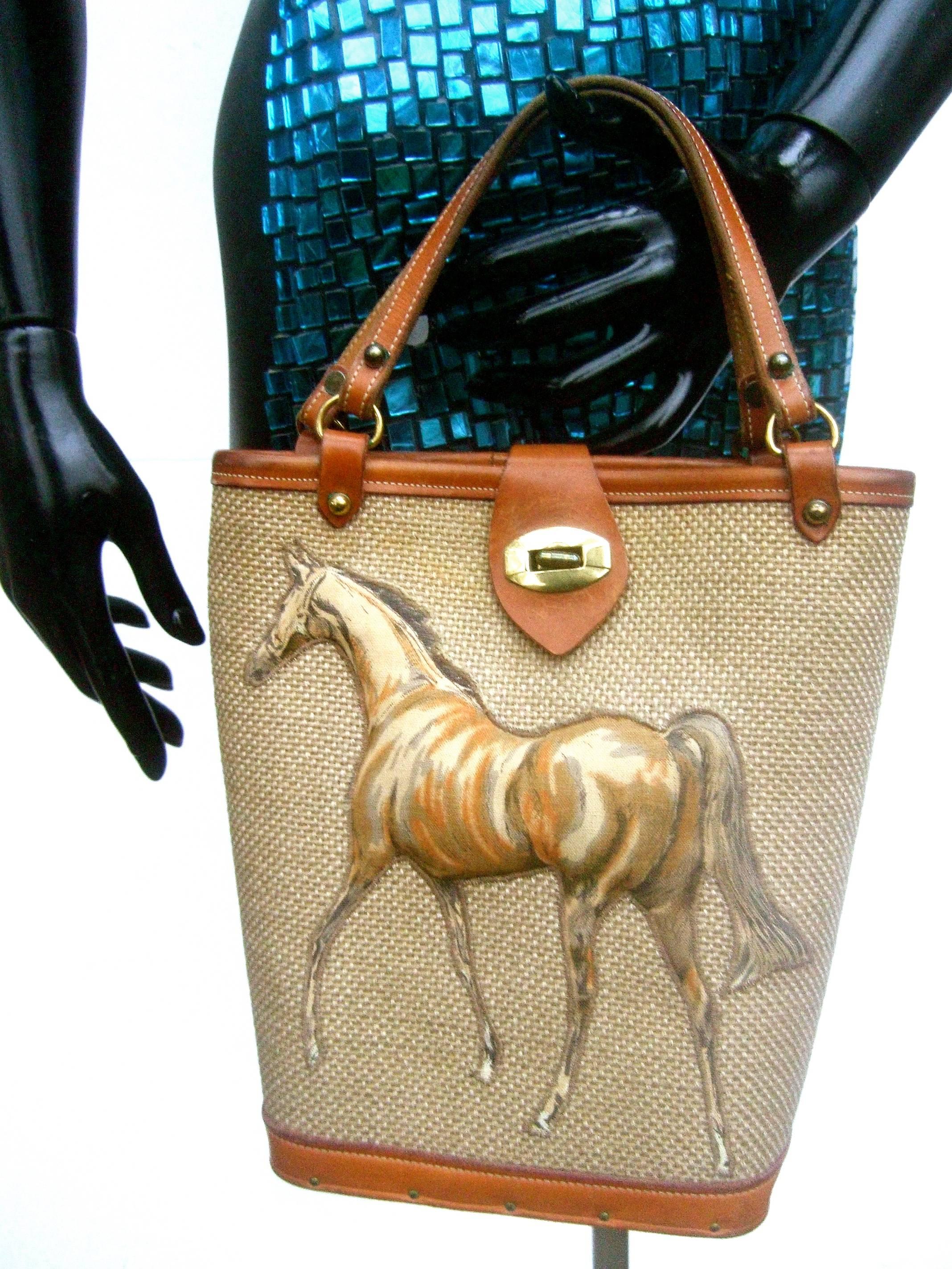 1960s Burlap cloth quilted equine leather trim handbag 
The unique retro tote style handbag is decorated with a three
dimensional quilted cloth horse figure on the front

The vintage midcentury handbag is designed with a burlap 
cloth panel that