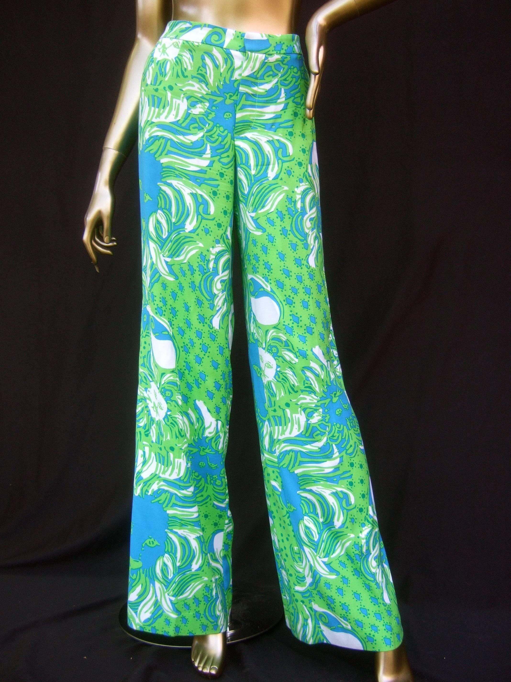 Lilly Pulitzer women's vibrant tiger print slacks US Size 6 
The resort-style summer high waisted flared slacks
are designed with silk screened tigers head graphics
with sinuous wavy manes repeated throughout 

The lime green and nautical bright