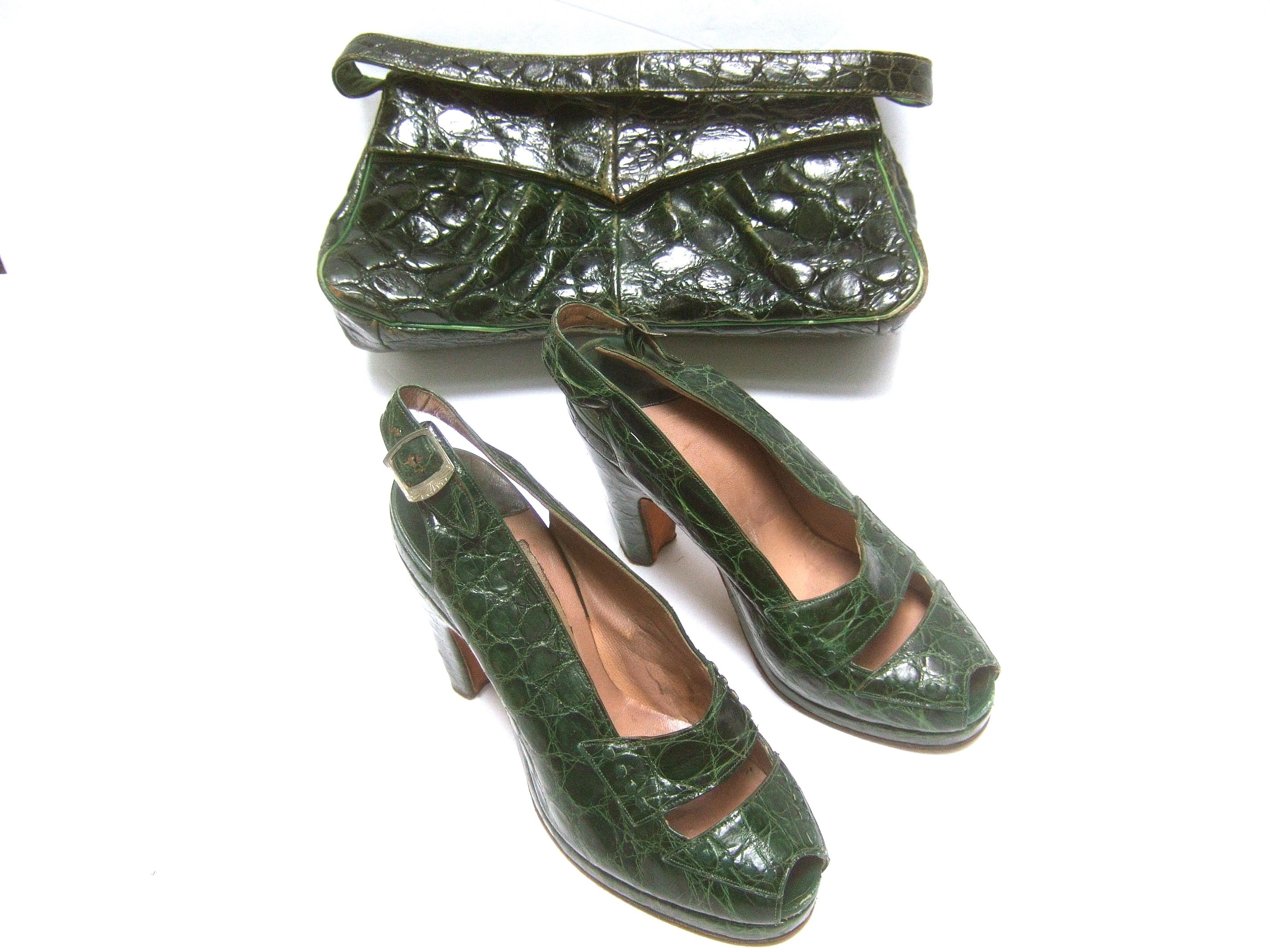 Saks Fifth Avenue 1940s Green alligator handbag & peep toe pumps set  
The stylish retro ensemble is comprised of a sleek forest green 
dyed alligator handbag; paired with the matching green alligator shoes

The ensemble makes a very chic, elegant