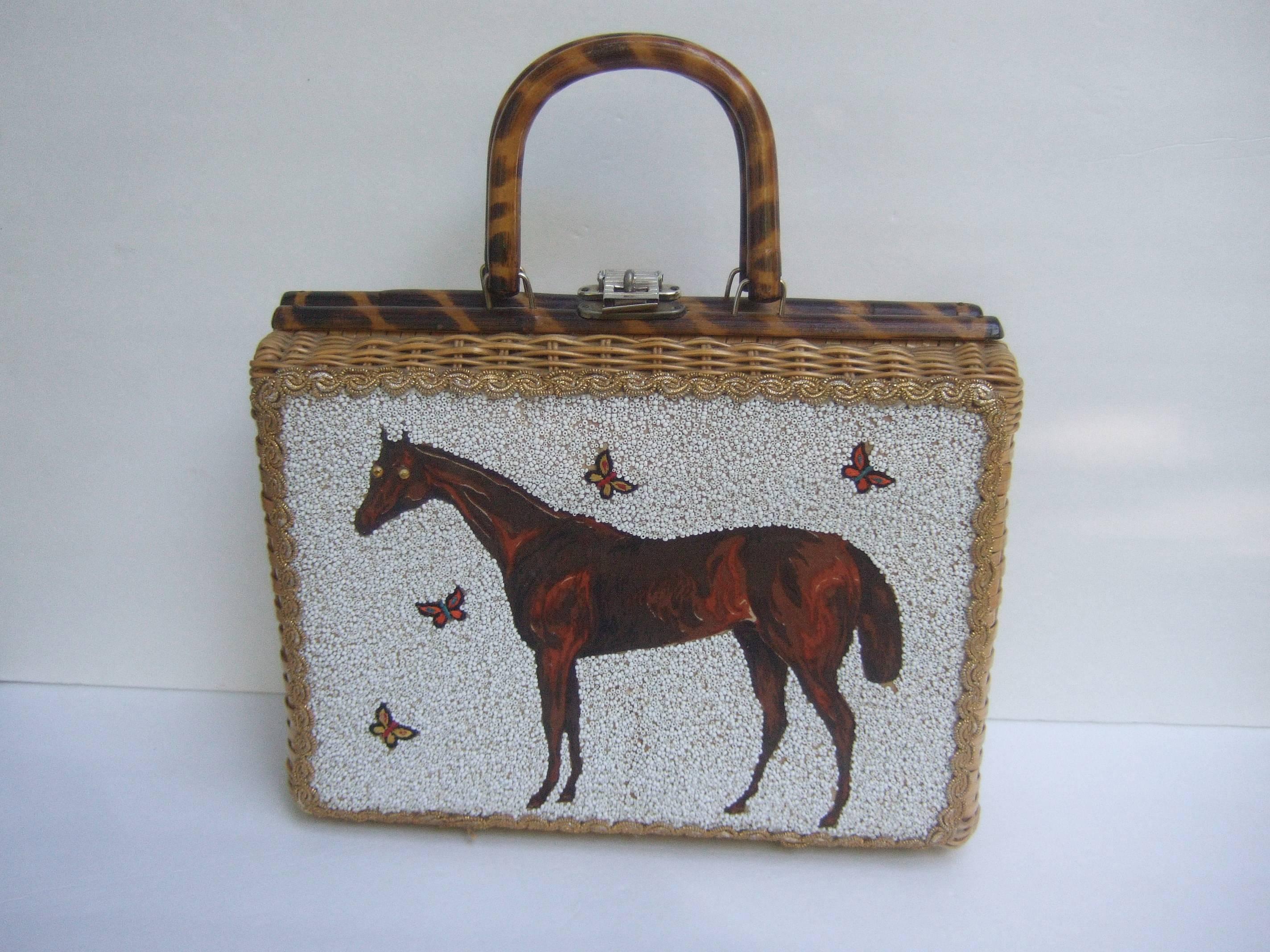Glass beaded wicker horse theme handbag c 1960 
The stylish retro handbag is designed with
a brown cloth figure encrusted with small
contiguous white glass micro beads

The majestic horse figure is surrounded 
by a series of small applique