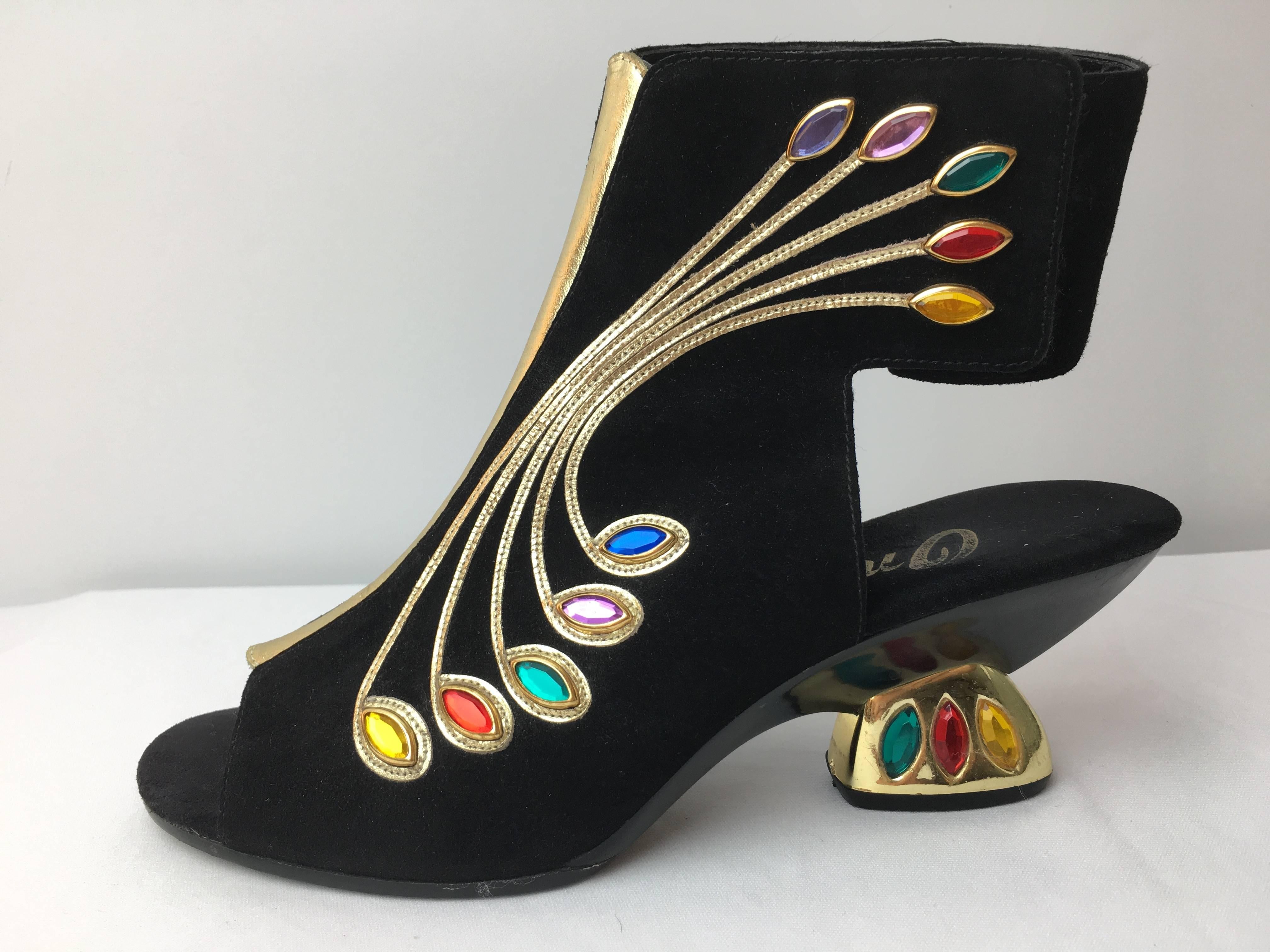 Decorate your feet in these amazing vintage, black suede, open-toed, ankle boots with a rainbow of multi-colored marquise shaped paste stones outlined in gold patent leather.  Gold plastic heel inlaid with more paste stones.  Simple gold patent