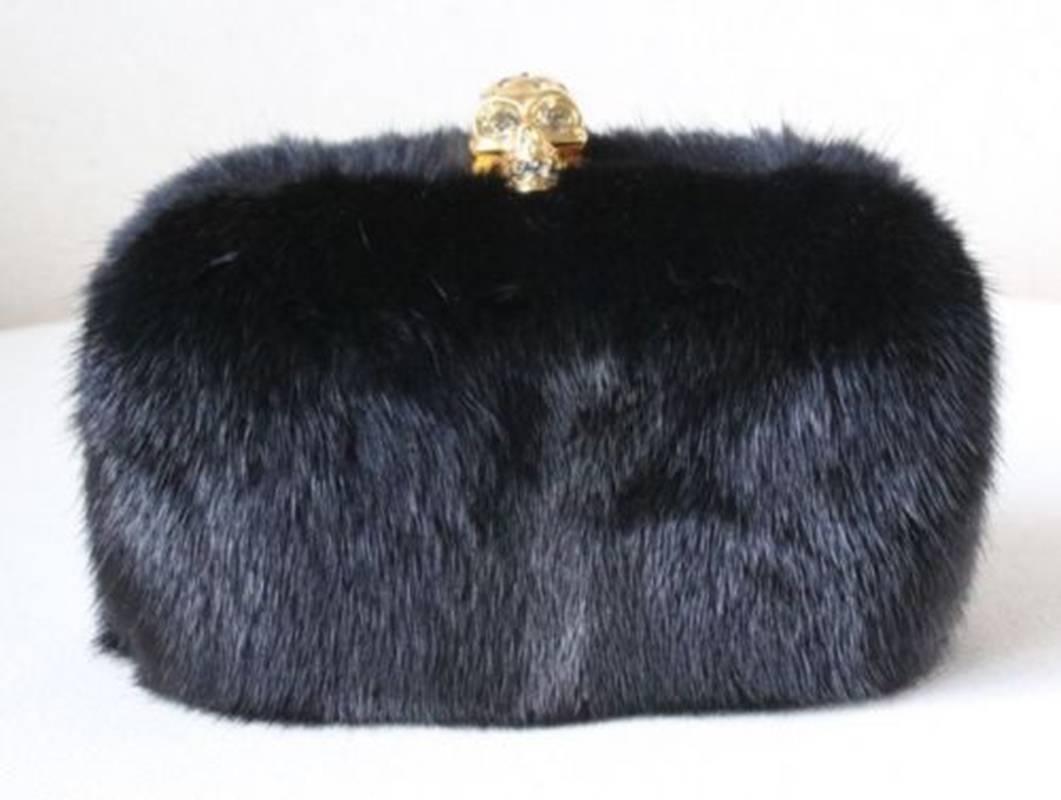 Having already re-imagined the classic box clutch with a signature, crystal-set skull clasp, Alexander McQueen adds one more twist of the unexpected with luxurious black mink.

Dimension: 17cm x 11cm x 7cm

Condition: Unworn. New without tags.