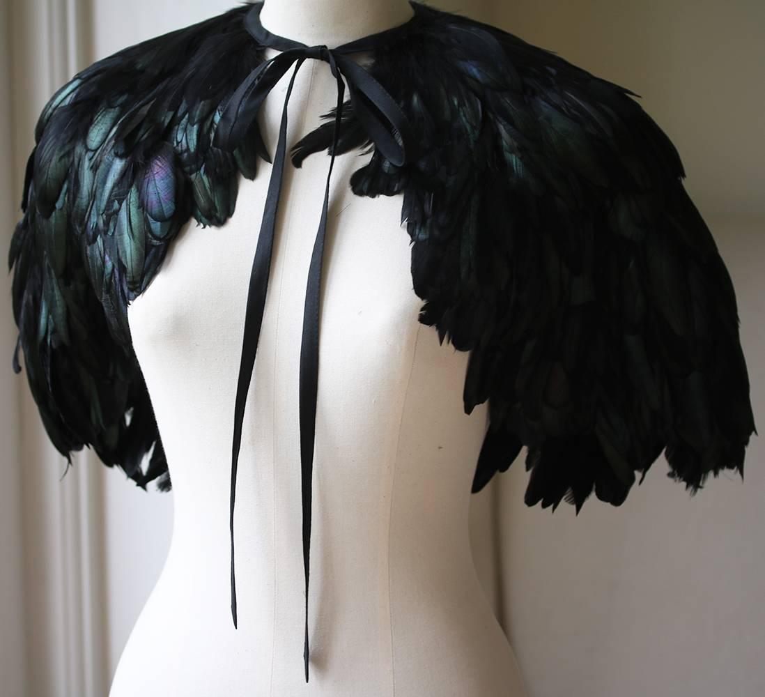 Stella McCartney for Chloé feather cape. Tie fastening at the front. Beautiful rich feathers. Change colour in different light. Statement collectors piece.  100% Feather. 

Size: One Size

Condition: Barely worn. No sign of wear. 