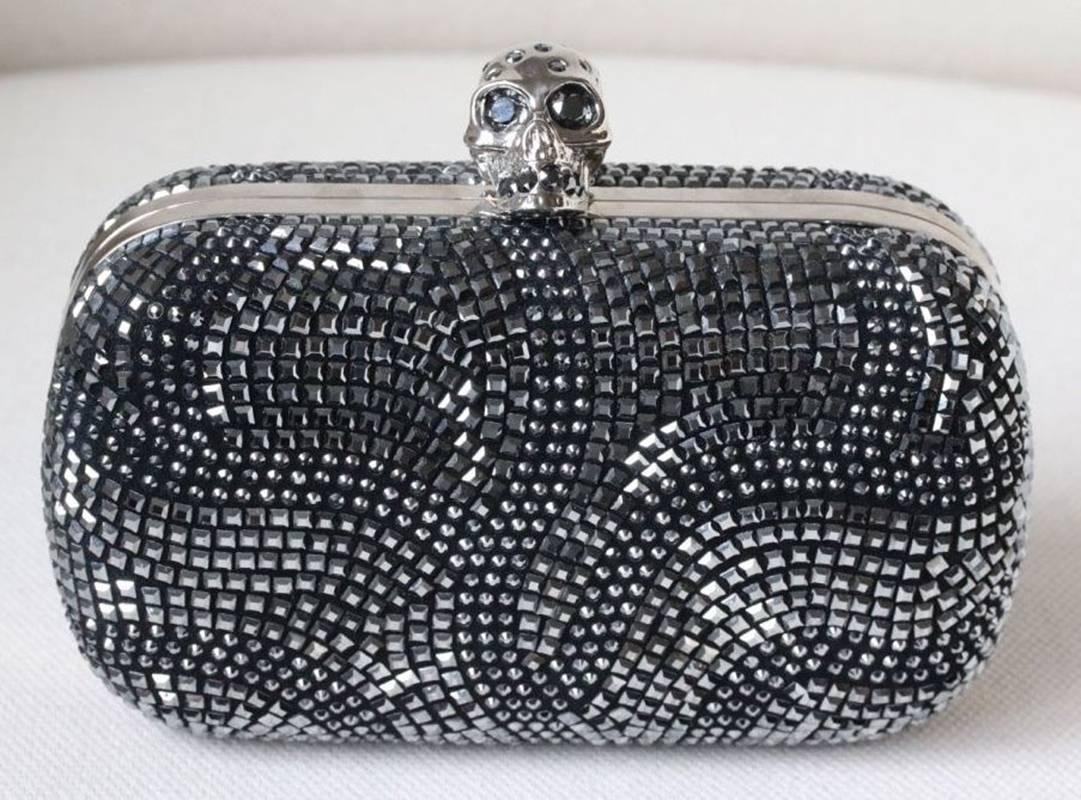 With a Swarovski crystal embellished skull clasp and crystal encrusted exterior, Alexander McQueen's box clutch embodies the label's punk-luxe aesthetic.

Dimension: 16cm x 10cm x 4cm

Condition: As new condition, no sign of wear. Please note: This