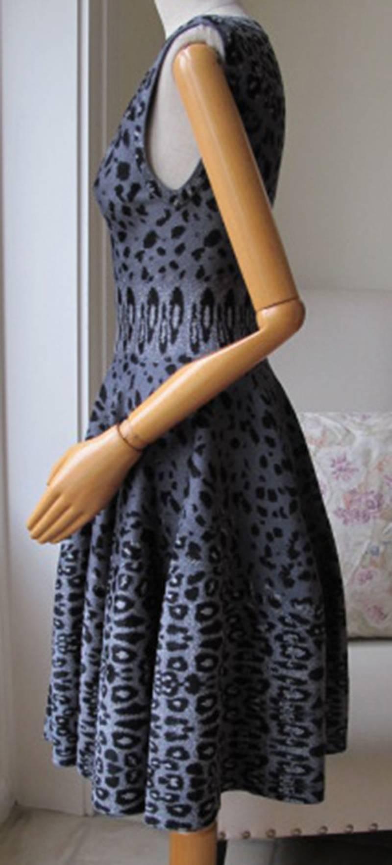 Stretch-knit dress from Azzedine Alaïa. All over textured leopard print. Straight-neck leads to a concealed zip down back. Sleeveless. Fitted waist leads to a fluted skirt. Unlined. 

Size: FR 40 (UK 12, US 8 IT 44)

Condition: As new condition, no