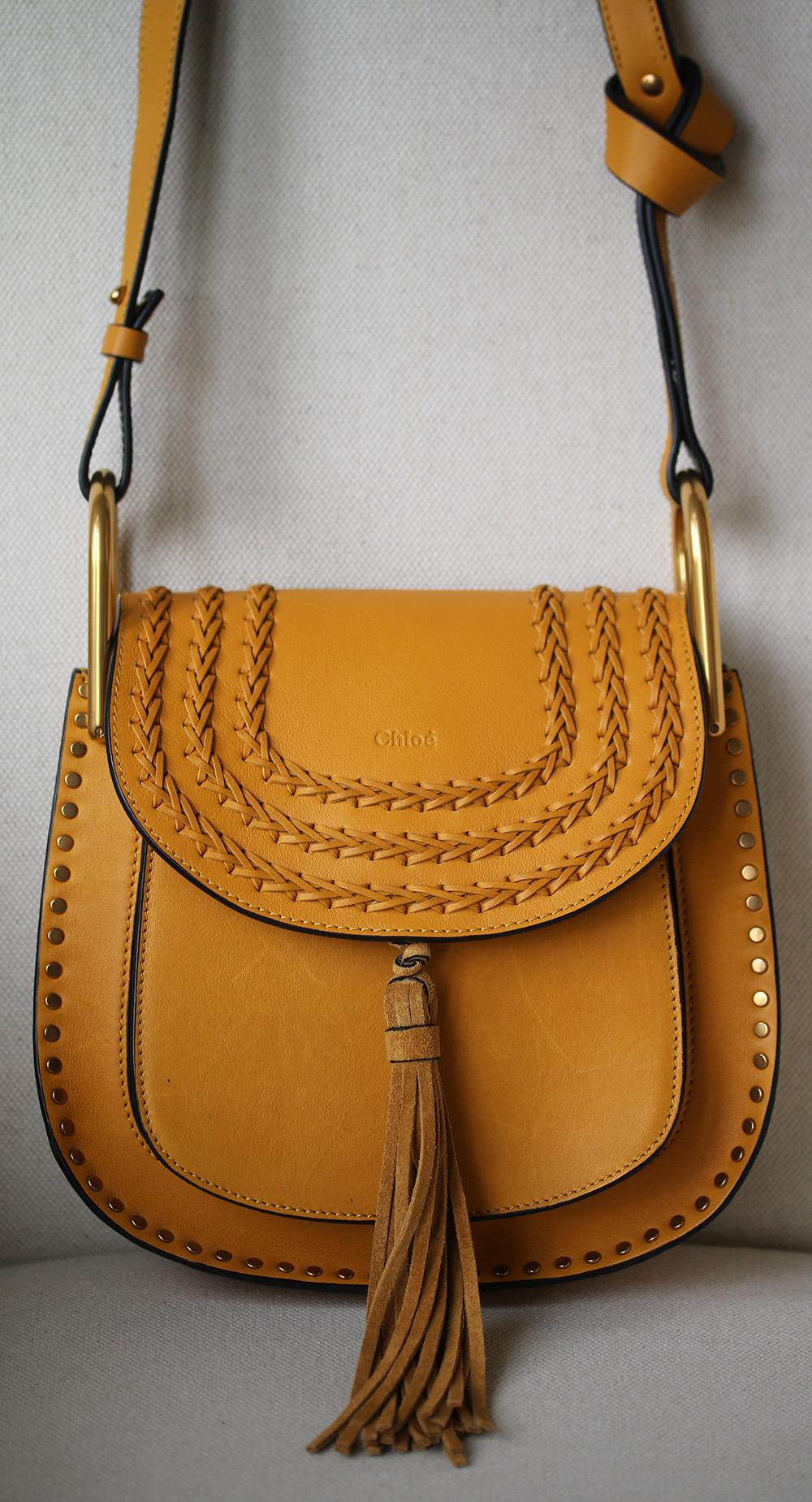 Chloé's small version of the iconic 'Hudson' bag is an effortless way to tap into this season's bohemian mood. Inspired by classic saddle styles, it's made from supple saffron leather that will become even softer over time and is finished with