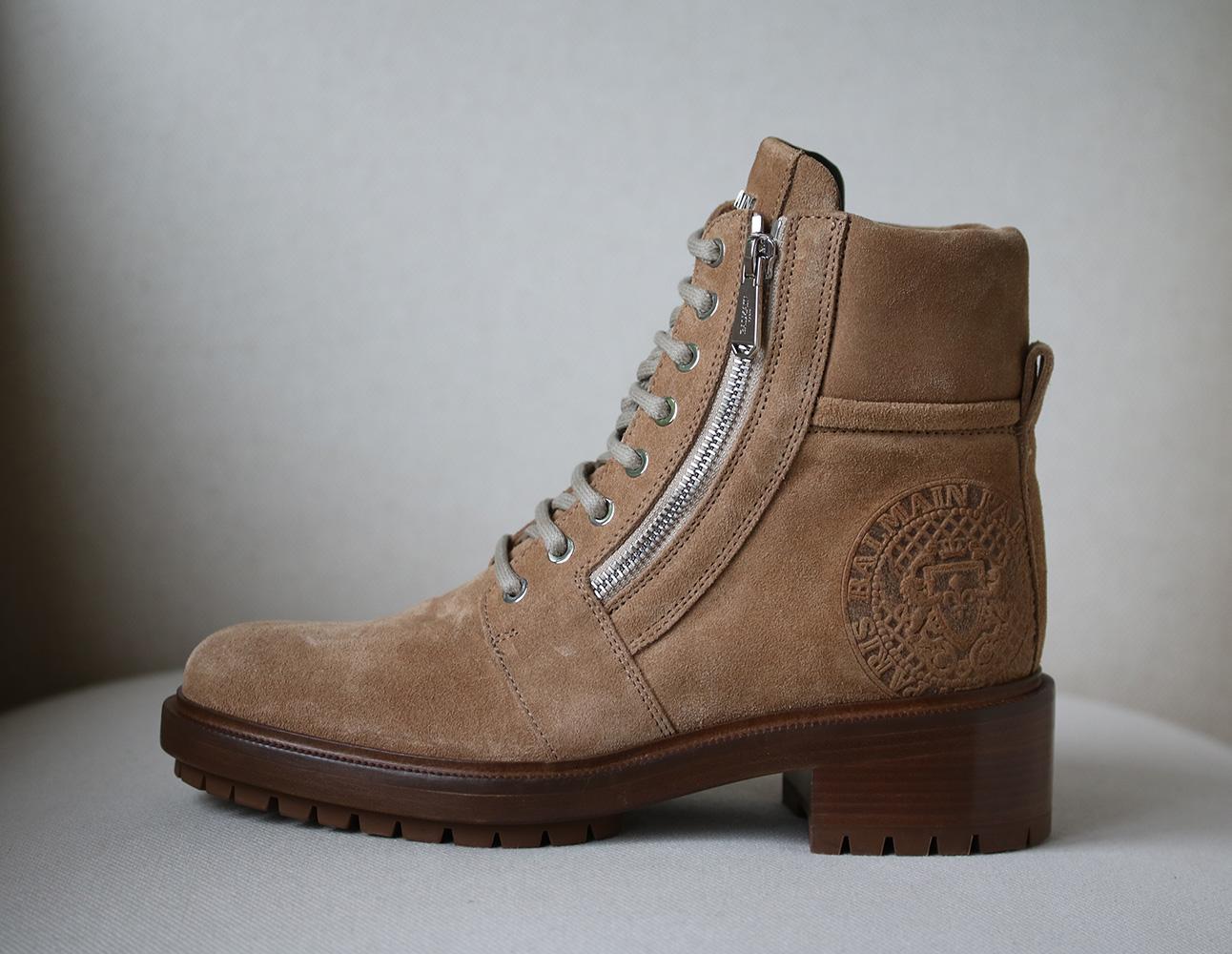 We love how Balmain incorporates the label's iconic medallion emblem throughout its spring collection - on these 'Ranger' boots, it's been subtly embossed at the back. This pair has been been crafted in Italy from beige suede and is detailed with