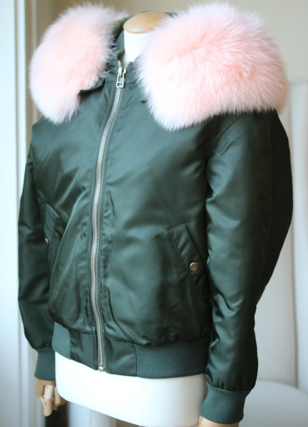 Exclusive to Barneys New York. Composed of green tech twill, Mr & Mrs Italy's bomber jacket is paired with a button-off hood. Showcasing the label's love of bright colors, the hood is trimmed with removable pink fox fur. Rib-knit stand shawl collar,