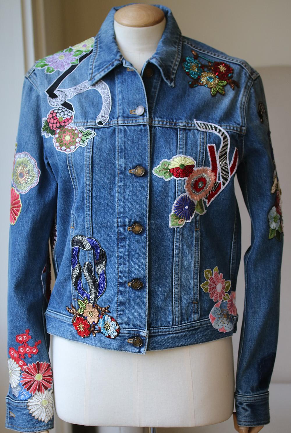 Saint Laurent's stonewashed jacket is cut from denim and finished with whimsical hand-stitched appliqués - a defining theme from the label's collection. Designed in a flattering slim silhouette, it's the perfect way to tap into the house's folkloric