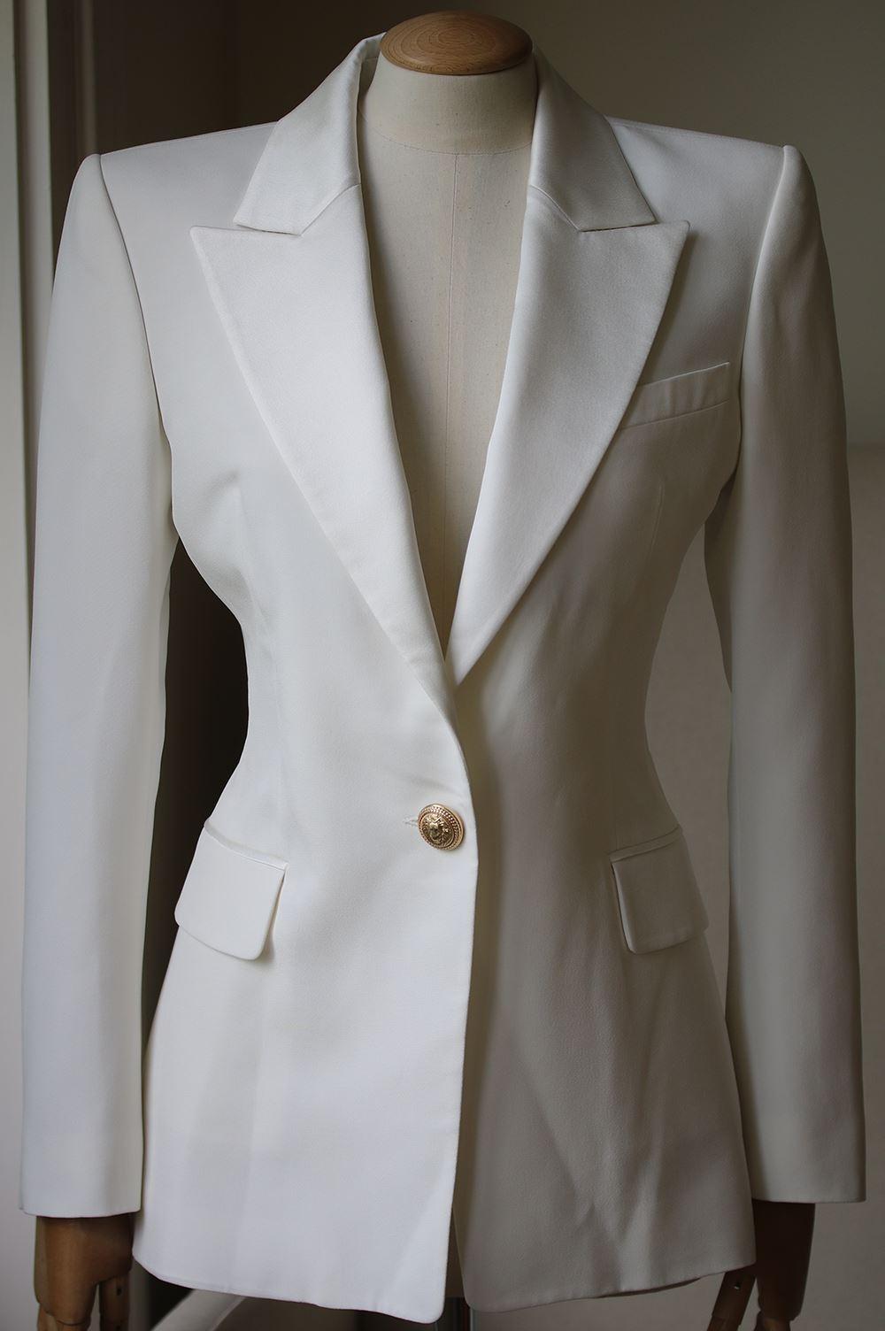 Balmain's Off-White Blazer Has Been Expertly Crafted In France From Crepe. This Tailored Style Has Signature Structured Shoulders And Military-Inspired Gold Buttons - The One At The Waist Is Positioned For The Most Flattering Cinching Effect.