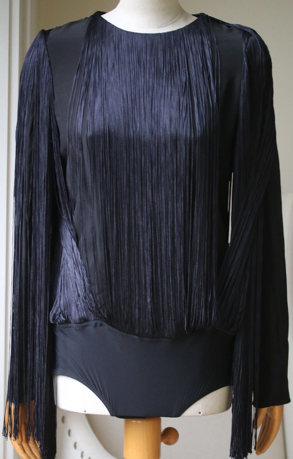 Midnight-blue stretch-jersey. Snap fastenings at base. 72% polyamide, 28% elastane; trim: 74% viscose, 28% silk. Made in France. Cut for a close fit. Fringe overlay. Mid-weight, slightly stretchy fabric. Those with broad shoulders may wish to take