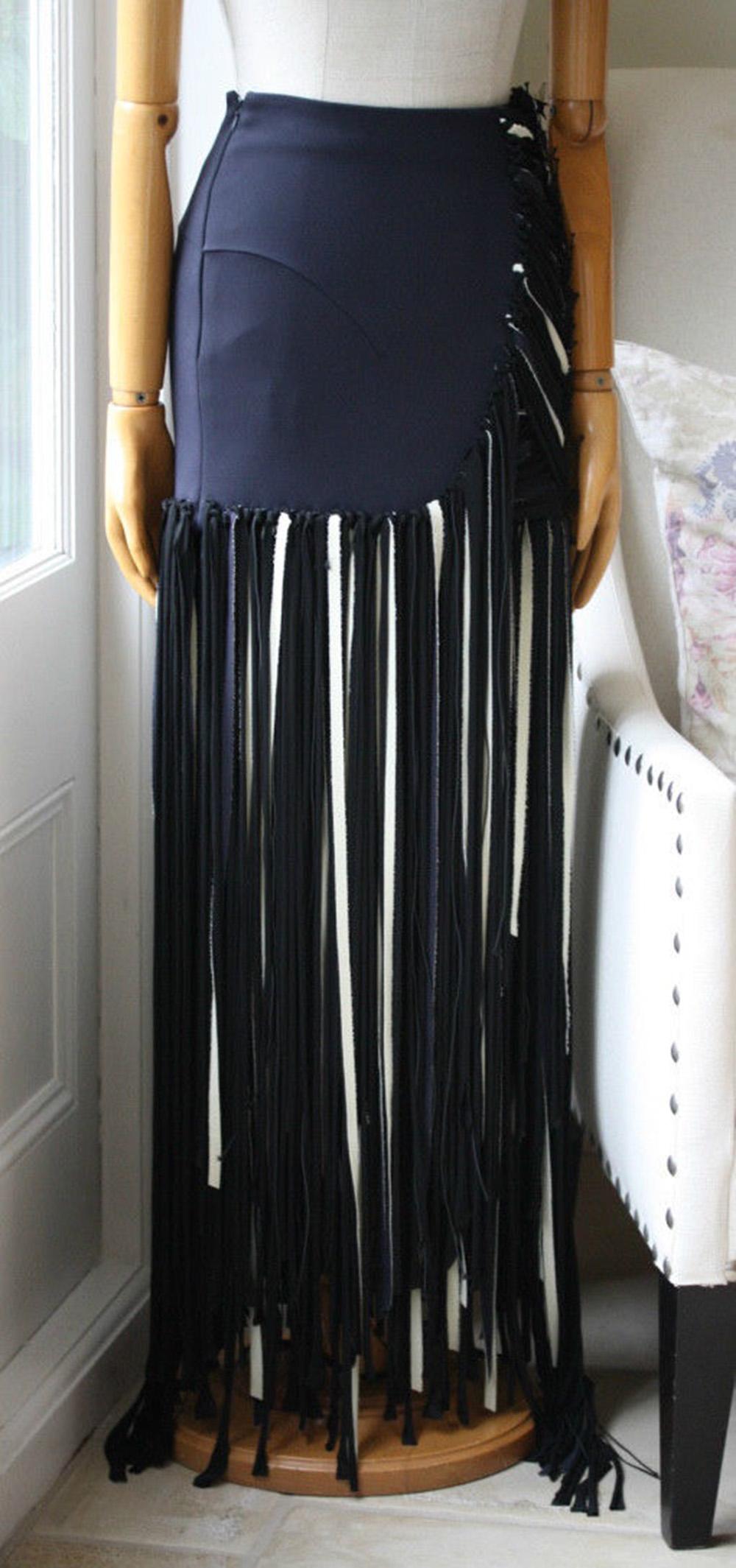 Esteban Cortazar's Italian-made maxi skirt is cut from ottoman-cady that smooths your curves. It's finished with rows of floor-sweeping cream and black shredded fringing – a key feature in the label's Fall '15 collection - and has a slashed-effect