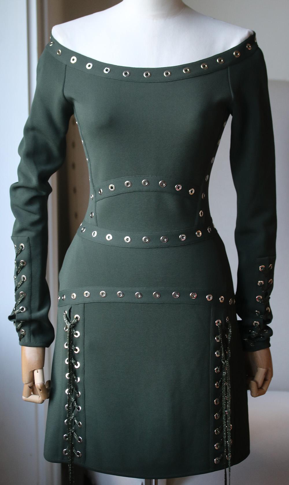 Elie Saab's Army-Green Mini Dress Is Sure To Be Spotted On The Coolest Party Girls - Natasha Poly And Kendall Jenner Are Already Huge Fans Of The Label. Cut From Sculpting Stretch-Knit To Hug Your Curves, It's Embellished With Silver Eyelets And