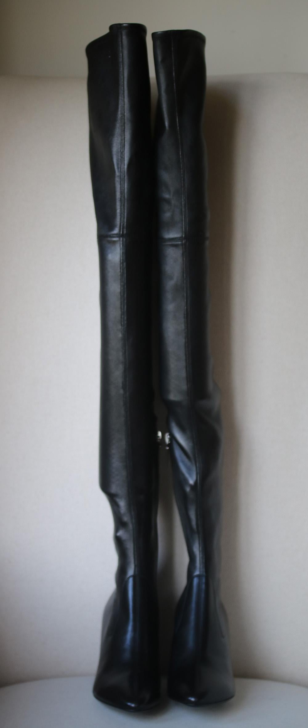 Thigh-high boots have been a favorite of Saint Laurent's since the original designer's era - a photograph of Yves in the '60s shows his friend and muse Betty Catroux wearing a pair similar to this one. Crafted from soft black leather, they have a