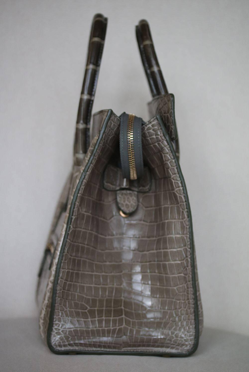 Celine Crocodile Handbag with Goldtone Hardware in beautiful crocodile leather in the most beautiful rich khaki colour with tonal green stitching. 
 
Condition - Leather is still stiff and untarnished. Has full feeling of a new bag. As new