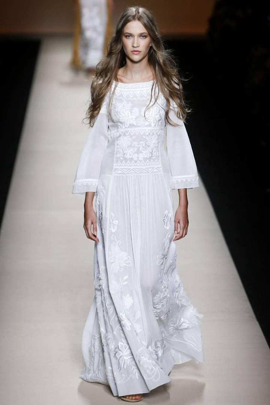 Alberta Ferretti's ethereal white gown is in line with the season's romantic bohemian mood. This silk-chiffon runway style is teeming with floral embroidery and appliqués, while the semi-sheer finish is tempered with a silk slip. White silk-chiffon.