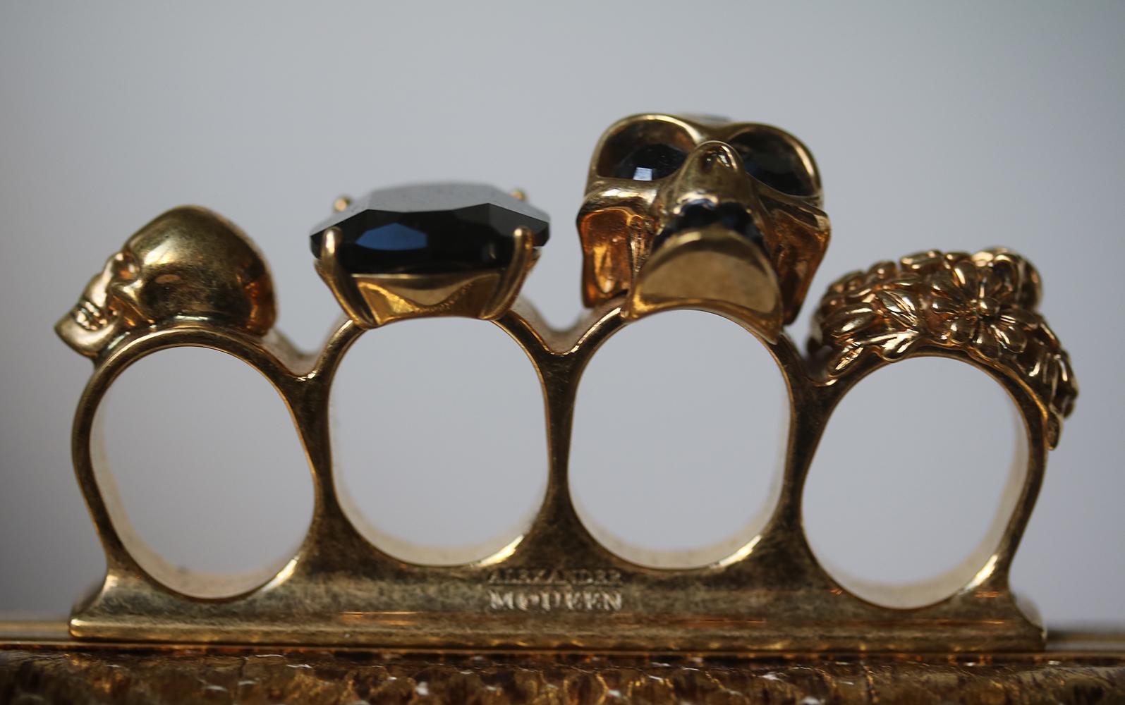 A classic Alexander McQueen Crystal encrusted and gold tone Skull Knuckle duster American Box Clutch, engraved name to the knuckle plate and embossed in the inside leather . Gold python edition with the brown leather interior, highly desirable.