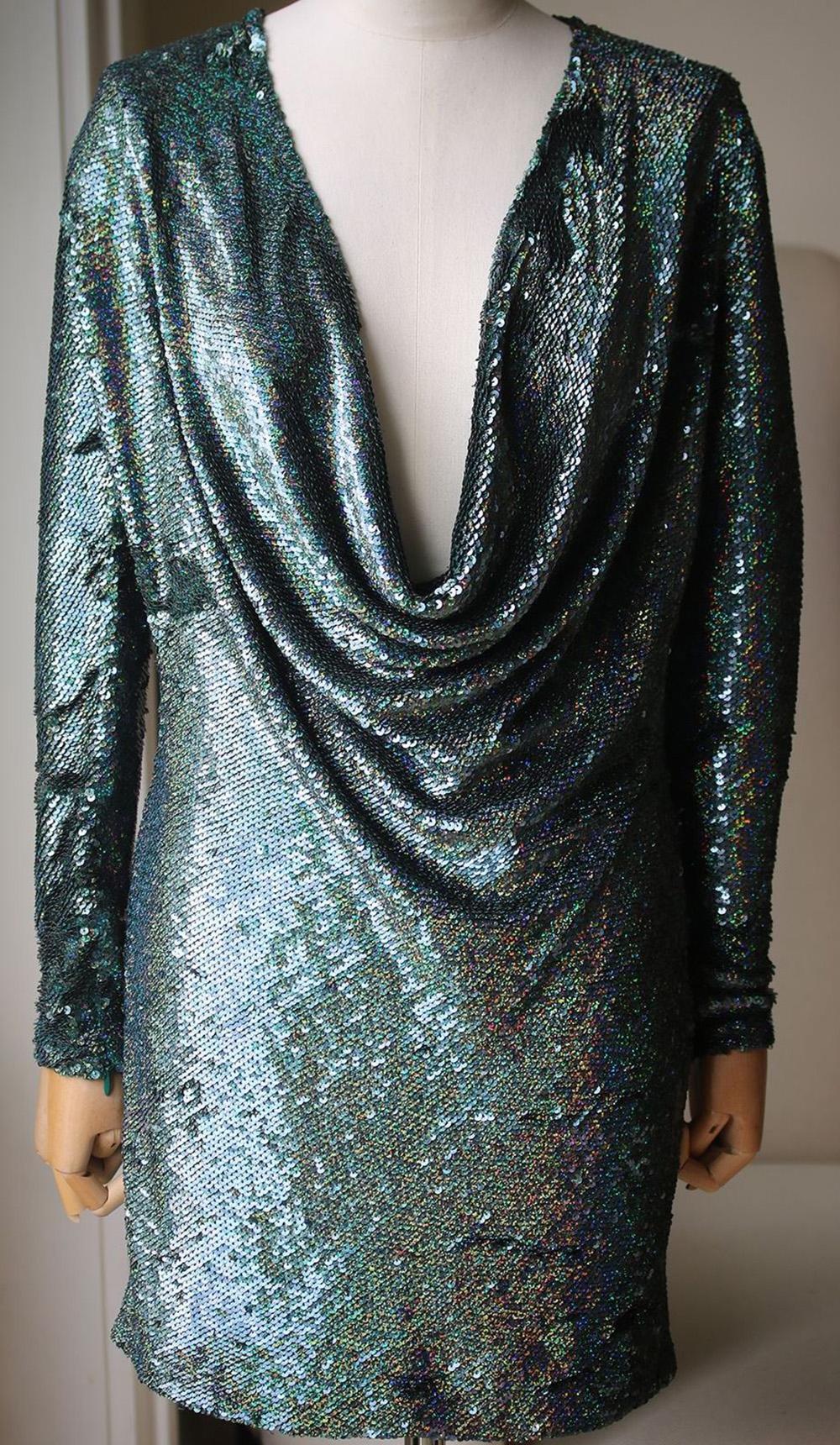 Submerged in forest-green sequins, Ashish's silk-georgette mini dress is destined for the dancefloor. It's crafted to a long-sleeved silhouette with a plunging cowl neck and hand-embellished all over by a small group of Indian artisans. 100%
