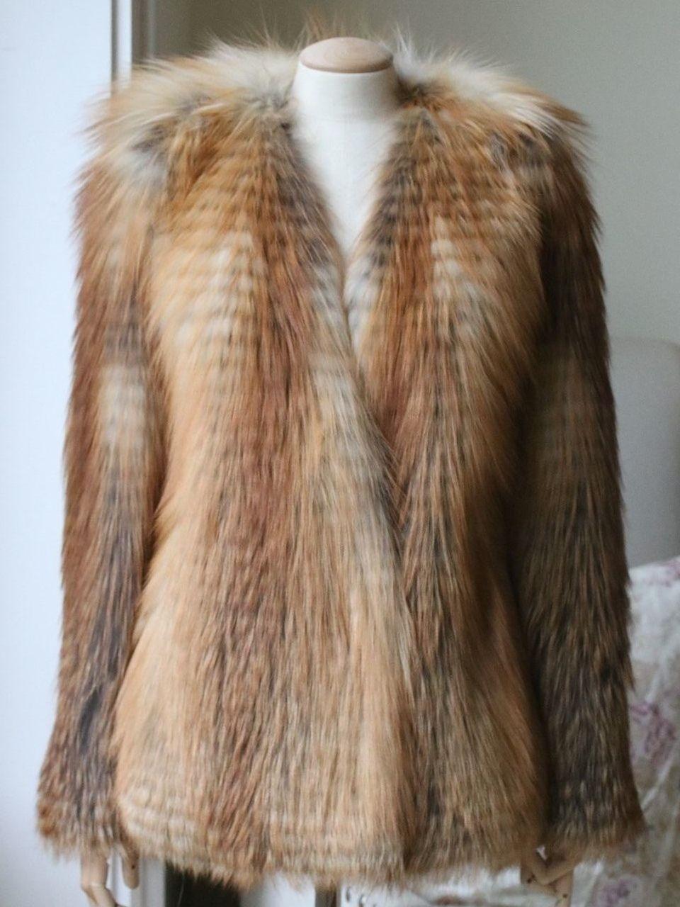 Balmain's tonal-brown fox-fur jacket is impeccably crafted in France. The slick, collarless shape is chic and timeless, while the waist-cinching black leather belt adds a tougher, contemporary attitude. Note the full silk lining – an exemplary