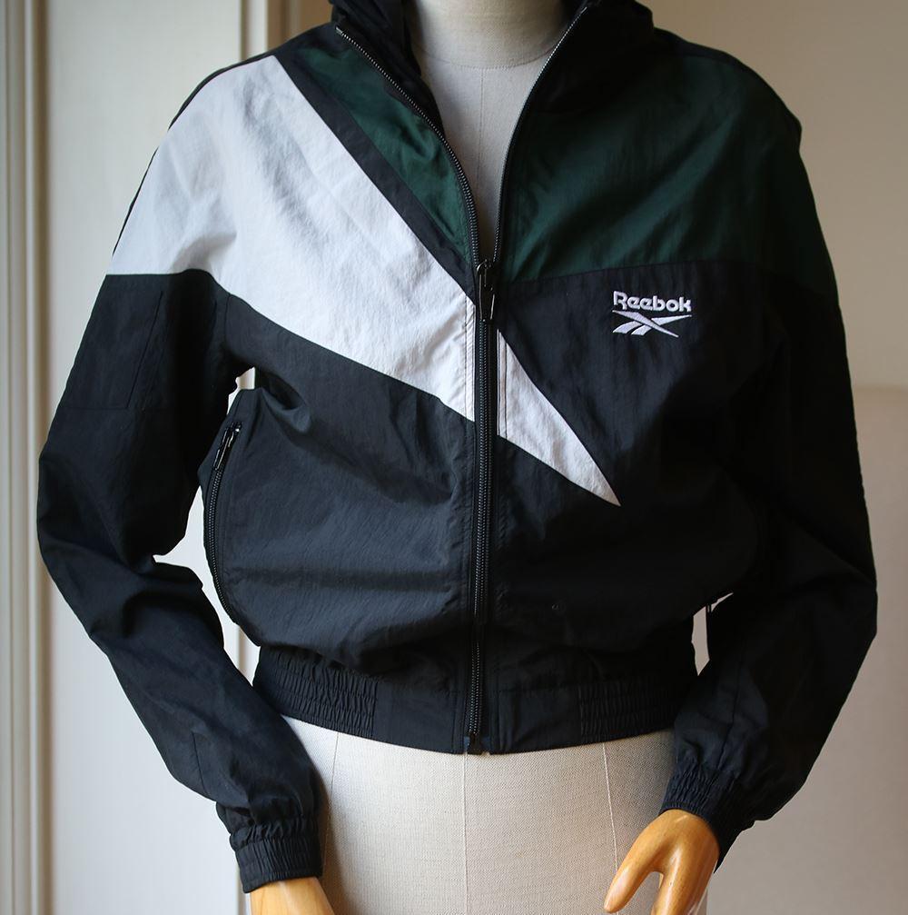 Self: 100% nylon. Lining: 100% poly. Mesh fabric lined. Zip front closure. Side zip pockets. Embroidery stitching detail. Optional hood.

Size: Small (UK 8, US 4, FR 36, IT 40)

Condition: New with tags.

