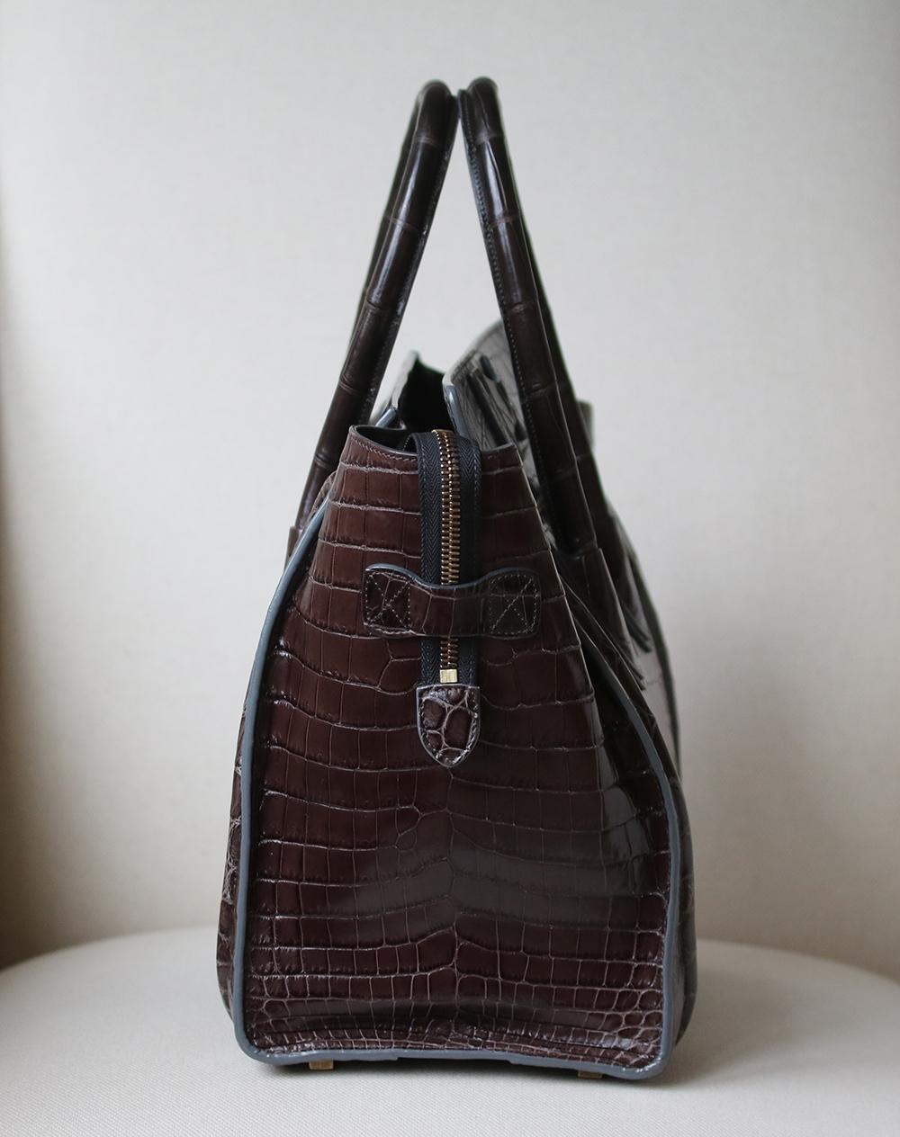 Celine Crocodile Handbag with Goldtone Hardware in beautiful crocodile leather in the most beautiful rich chocolate brown colour with tonal stitching. 
 
Condition: Excellent used condition. Leather is still stiff. A few minor marks inside and