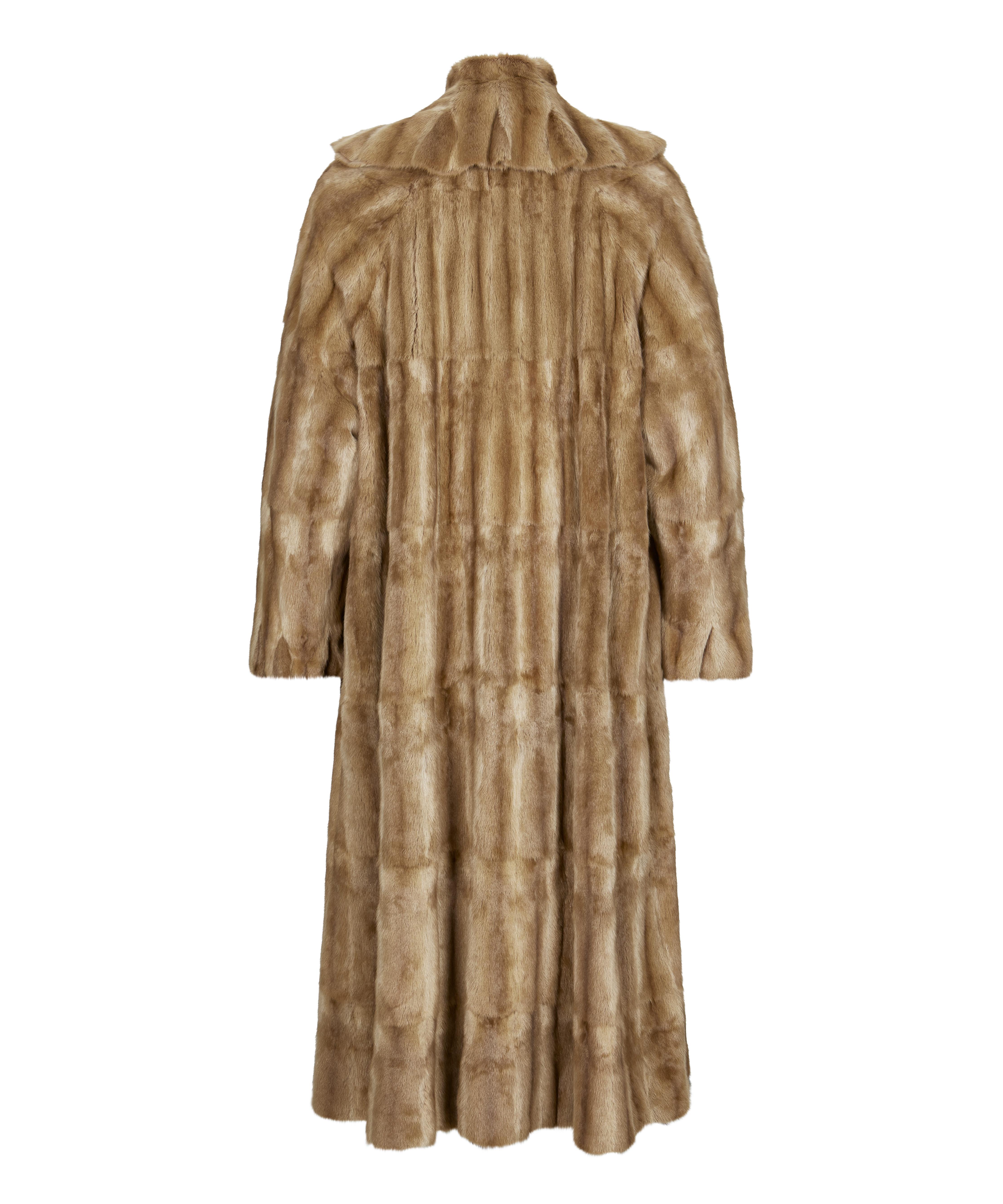 A classic light brown ermine fur coat with ruffle detail along the collar. Light brown ermine fur. Fur hook closure. Champagne colour silk Fendi logo lining. Fendi insignia throughout the lining. Long sleeve. 100% Ermine fur. Made in Italy. Color: