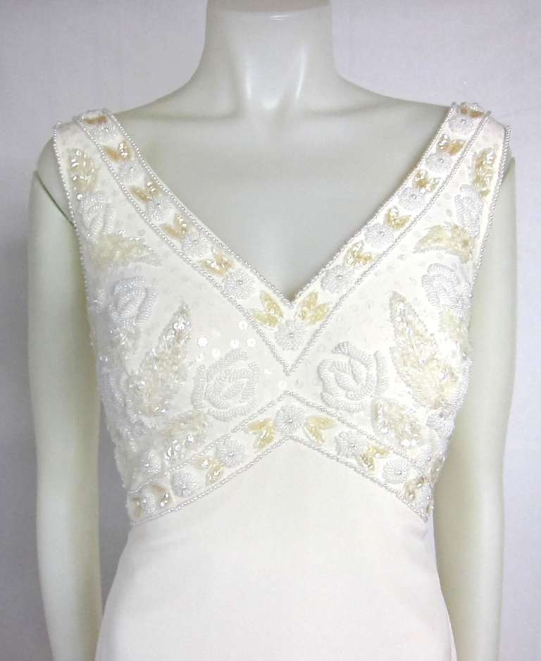 Gorgeous dress. Wear to special occasion or wear for your wedding. Creamy white,  faux pearl, sequin beaded V empire waist long dress with Subtle Train. Lined.
Size 10
Bust 38
Waist 30
Length 60+24 for train.