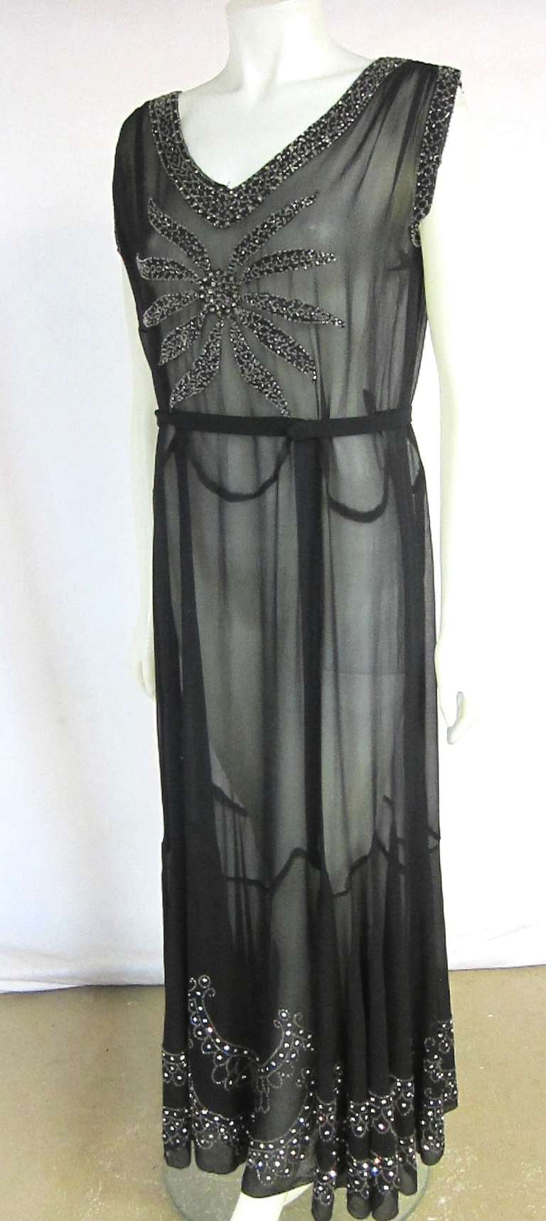 Gorgeous 1930s Black Sheer Chiffon Heavily Beaded and rhinestone encrusted Gala Formal dress. A dress that you see in a TMC movie!

Bust:   44