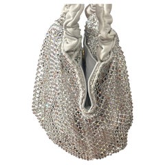 A never used Iridescent Crystal and Ruched White Leather Mesh Bag by Gedebe
