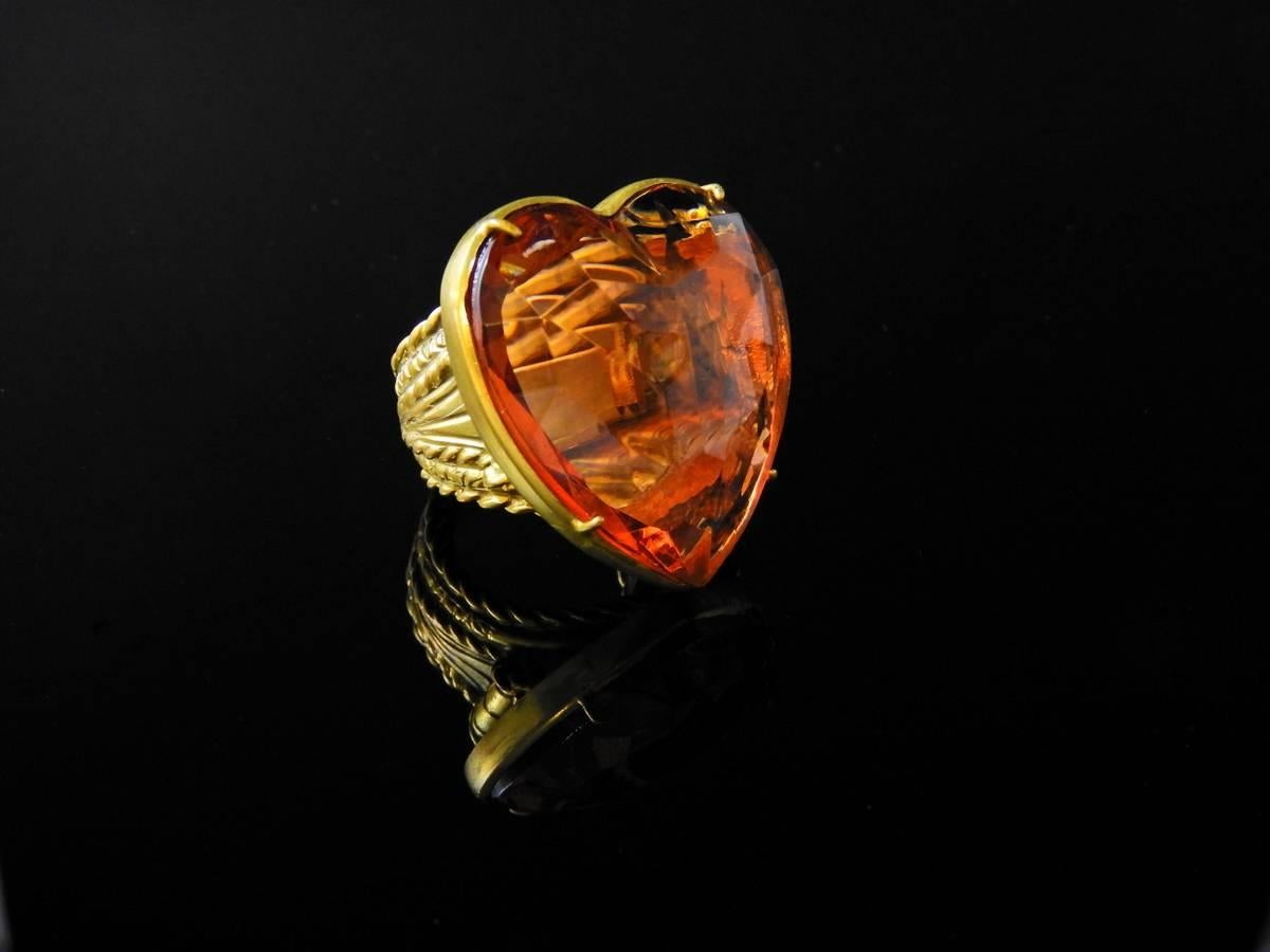 Bronze and yellow Murano glass heart ring from the flat collection. Inside the ring is placed an hard spring in order to adapt the ring to any finger size.
Murano Glass piece has been cut by an expert craftman. Ring is made in Florence by goldsmith