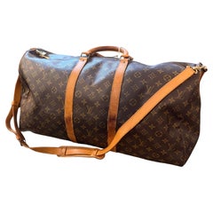 A 1989 Iconic Brown Monogram Canvas Keepall 55 Bandoulière by Louis Vuitton