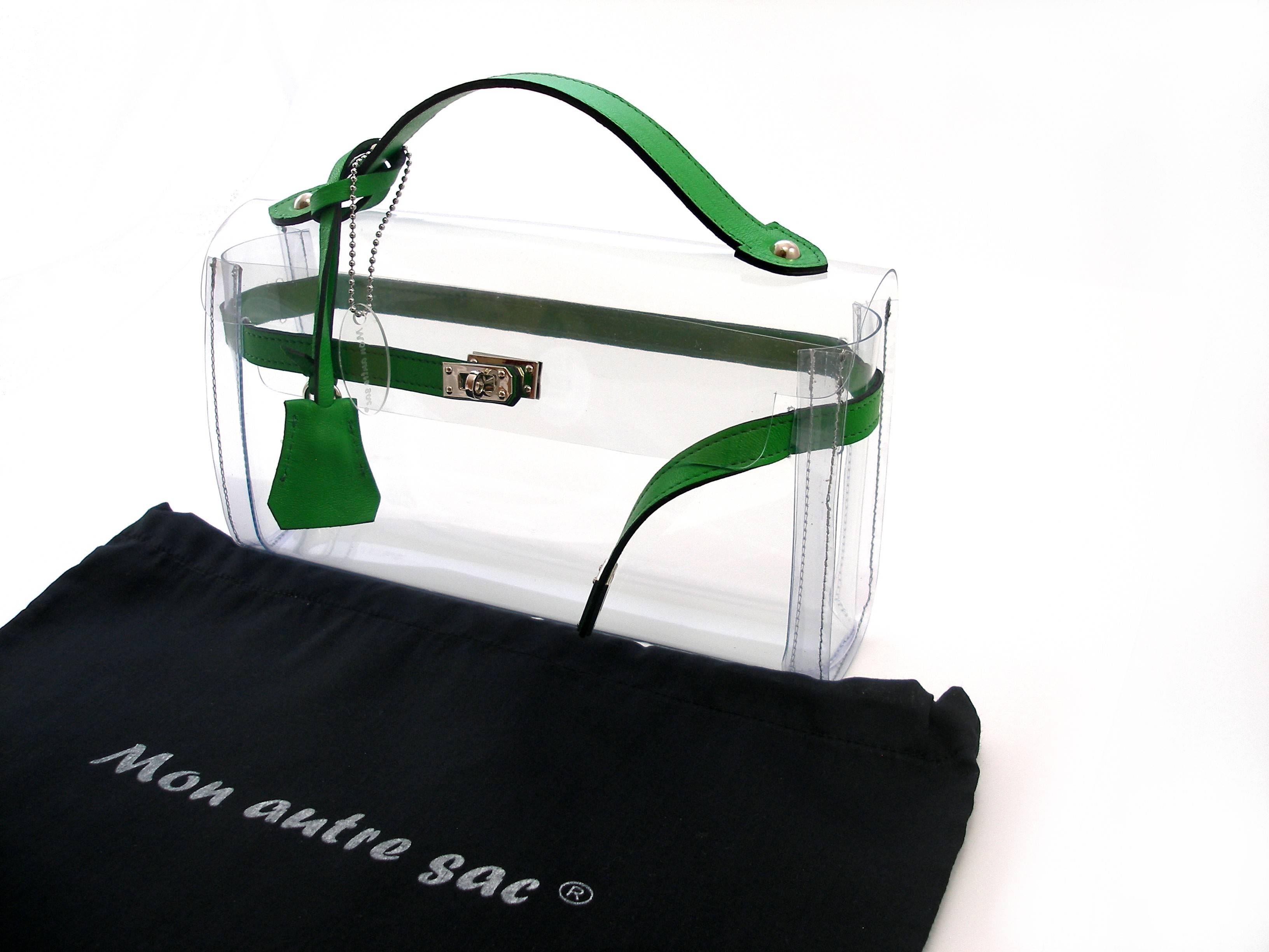 MA-GNI-FIC 
Our own production and brand filed Mon Autre Sac ® 
Highlight your luxury accessories!
Nice Pvc and Leather Bag 
Clutch Crystal 
Size :   L 25 X H 14 X P 6
Green leather 
Brand New
Its comes with dustbag  Mon Autre Sac ®
And Gift package