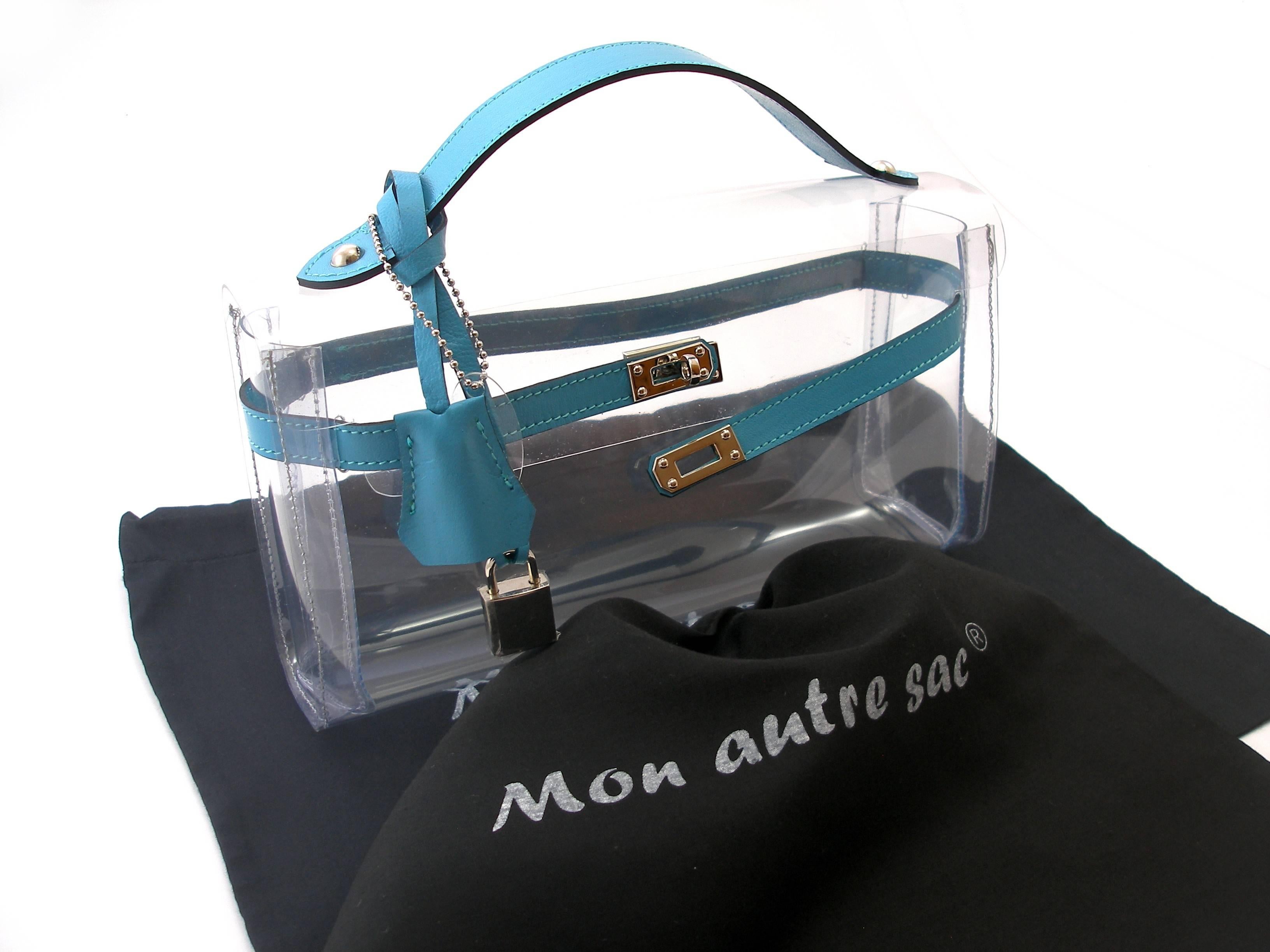 MA-GNI-FIC 
Our own production and brand filed Mon Autre Sac ® 
Highlight your luxury accessories!
Nice Pvc and Leather Bag 
Clutch Crystal 
Size :   L 25 X H 14 X P 6
Bleu leather 
Brand New
Its comes with dustbag  Mon Autre Sac ®
INTERNATIONALS