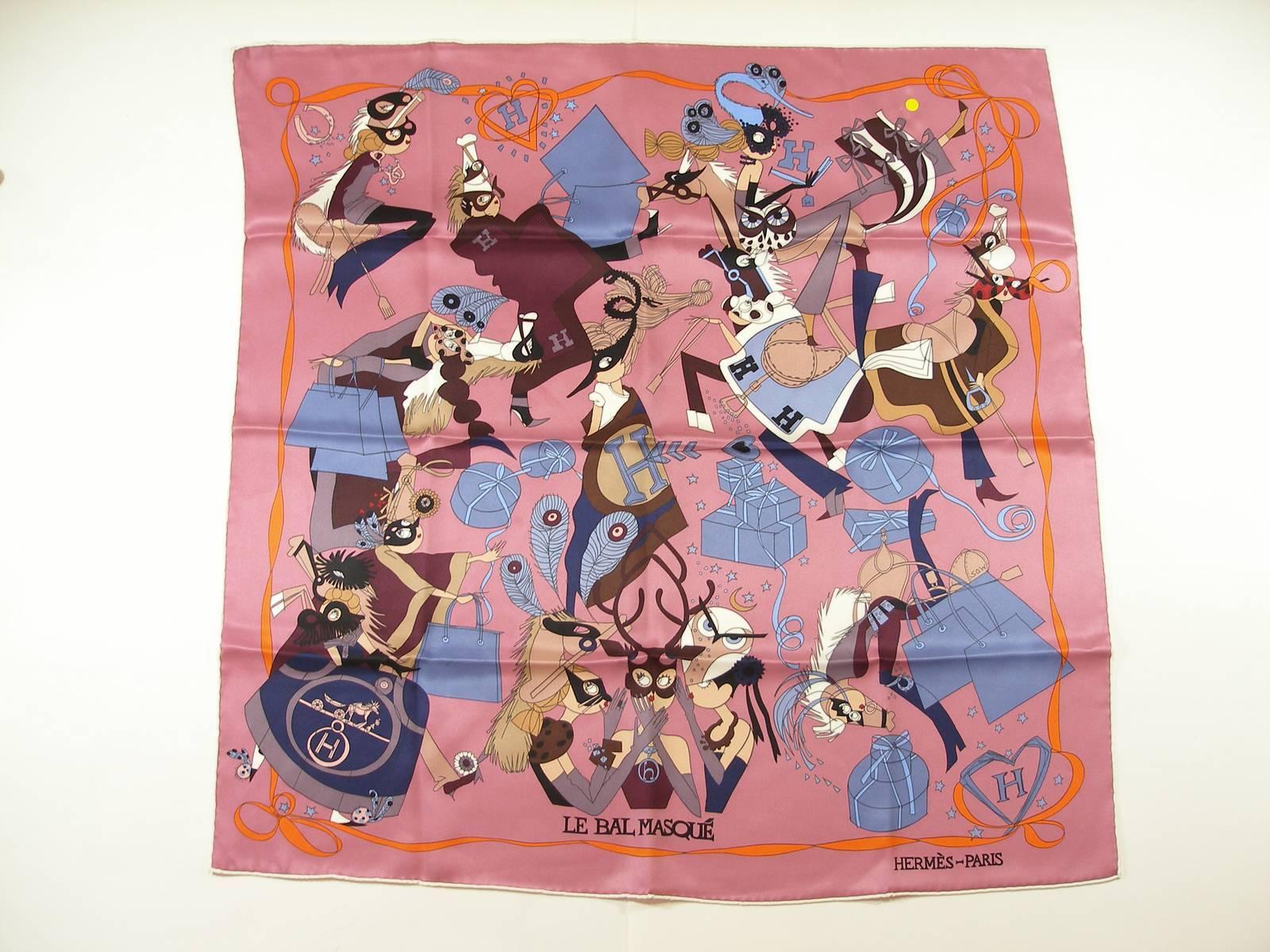 Rare and impossible to find 
Hermès Collection 2014 
Vintage scarf Le Bal Masqué 
This is a 100% silk scarf with a cartoon masquerade ball motif on a pink background
Size : 70 cm x 70 cm 
Retail price : $300 
Never used 
Please note for this