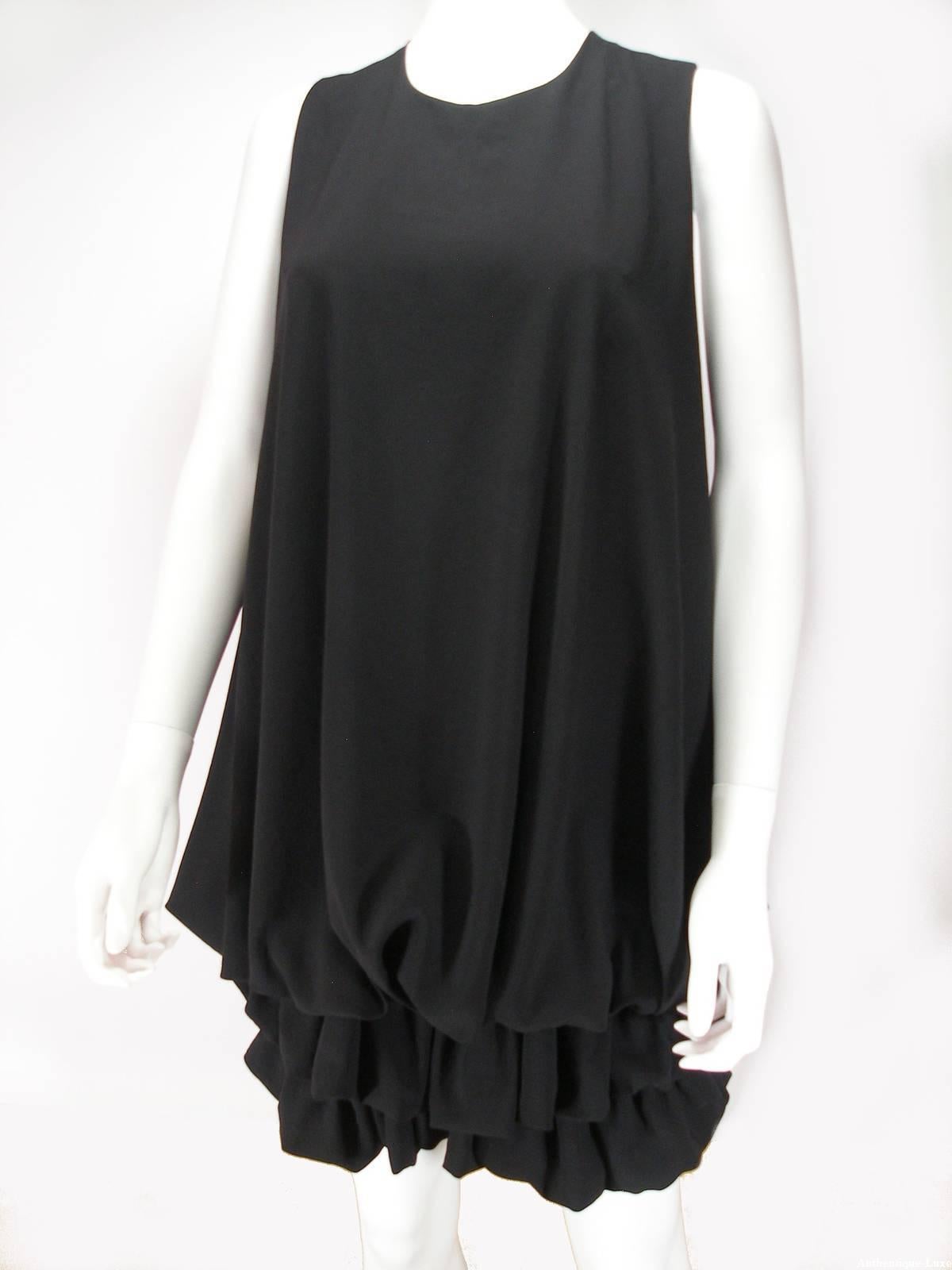 Black Givenchy polyester sleeveless mini dress  , scoop neck bubbled hem. 
Length: 35/36